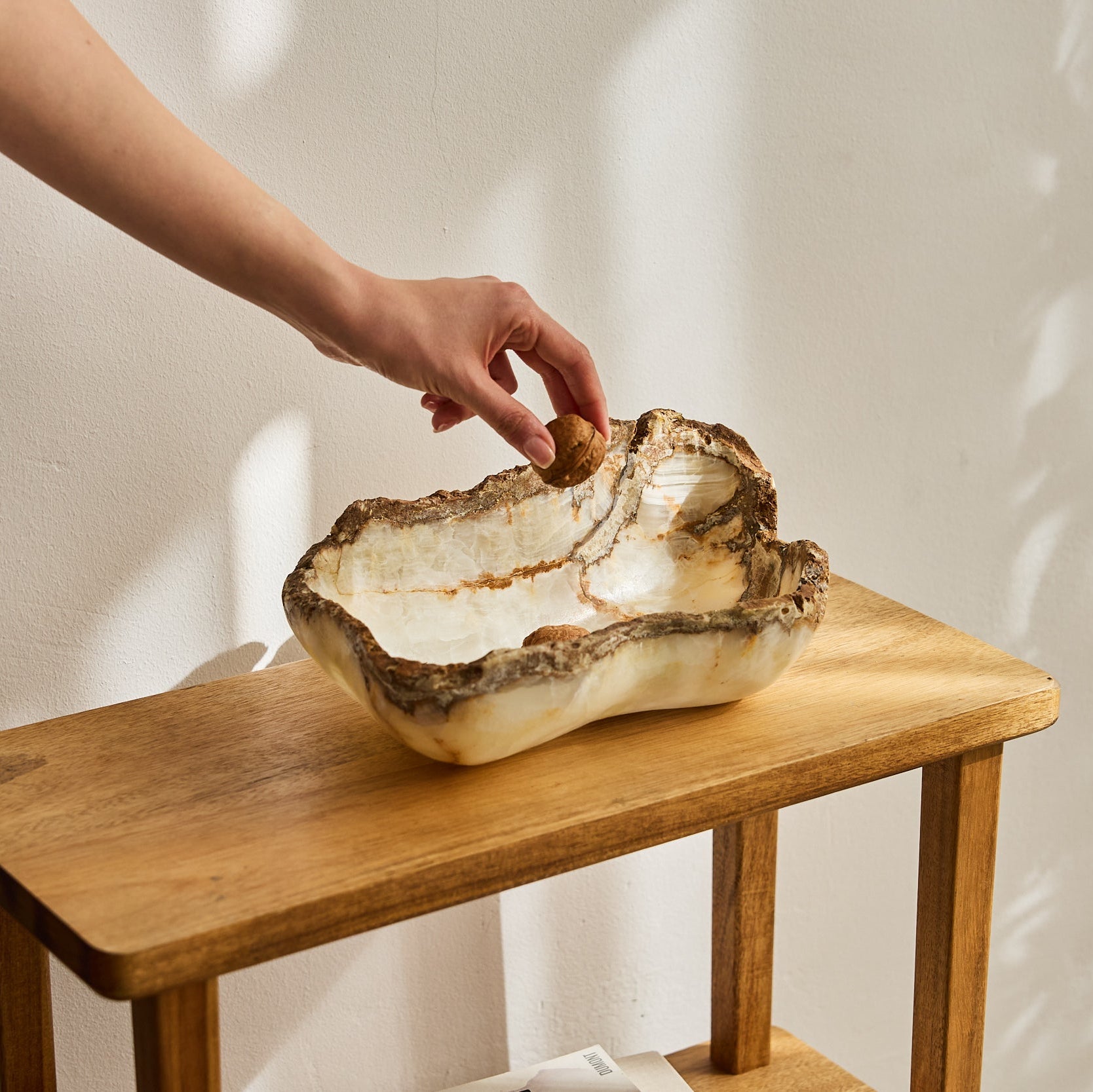 Rough onyx bowl with raw edges and ivory color.