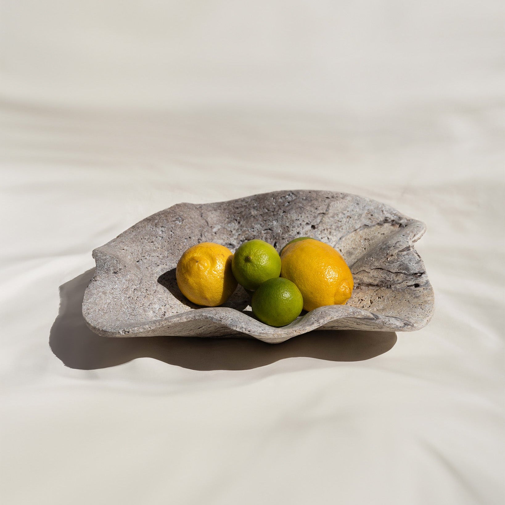 Aeolis Bowl handcrafted travertine bowl by Uniiqo Studio for luxury homes