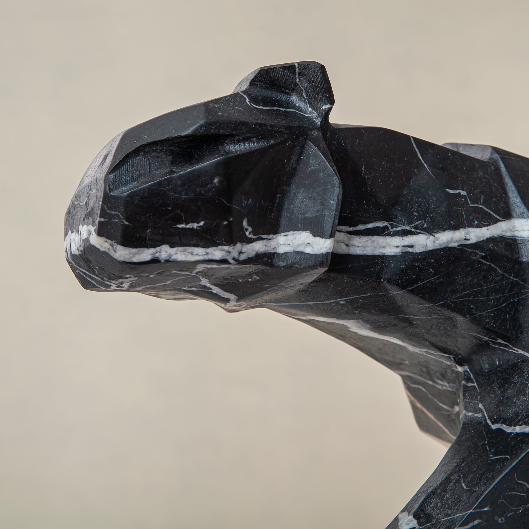Black marble panther sculpture with white veining, handcrafted modern decor