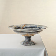 handcrafted onyx bowl with pedestal base and ivory tones with dark veining for luxury centerpiece

