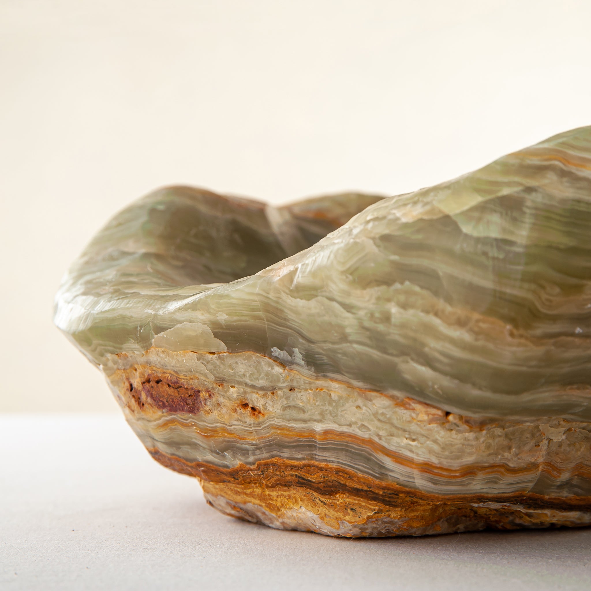 handcrafted onyx bowl with warm amber tones and natural veining for luxury table decor
