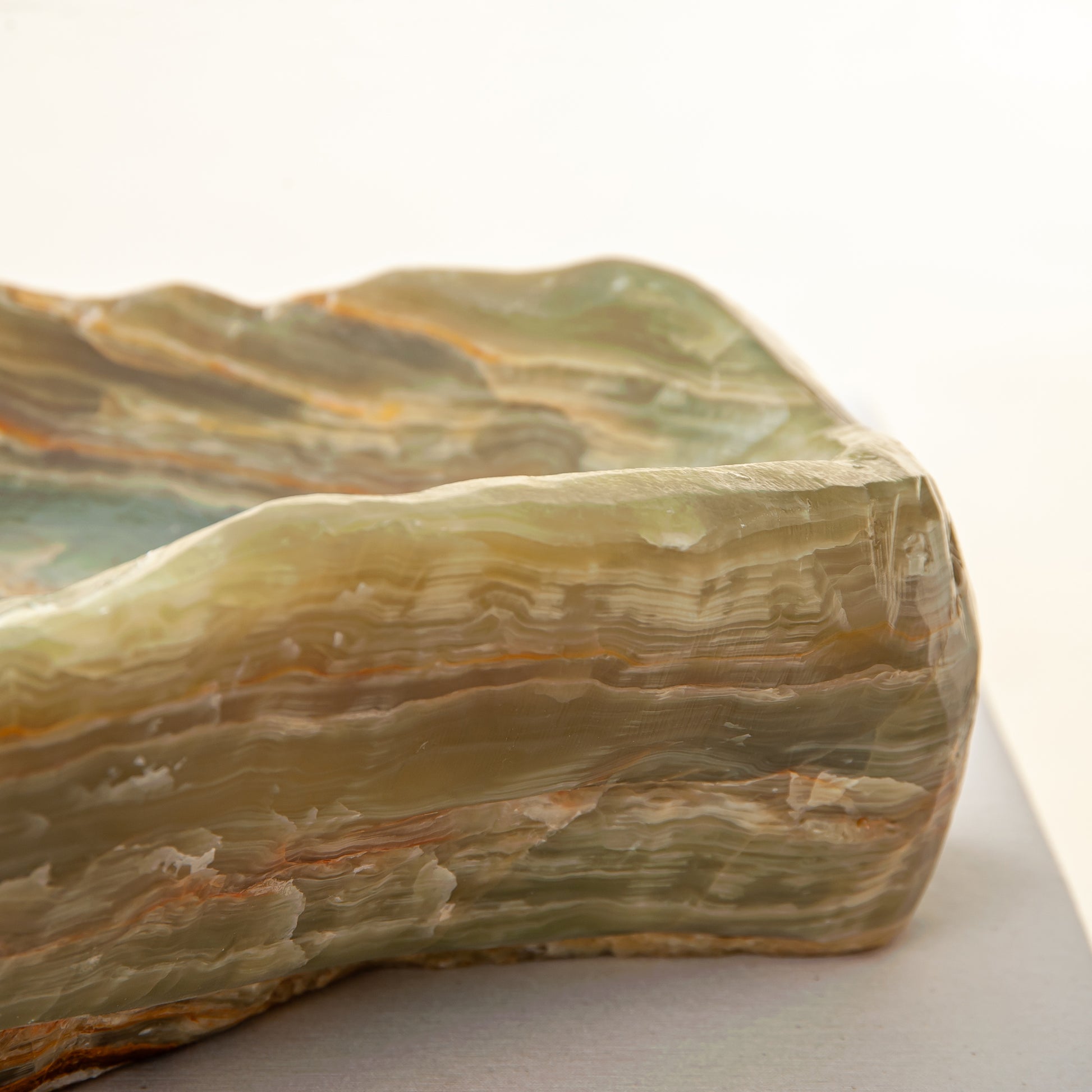 handcrafted onyx bowl with warm amber tones and natural veining for luxury table decor
