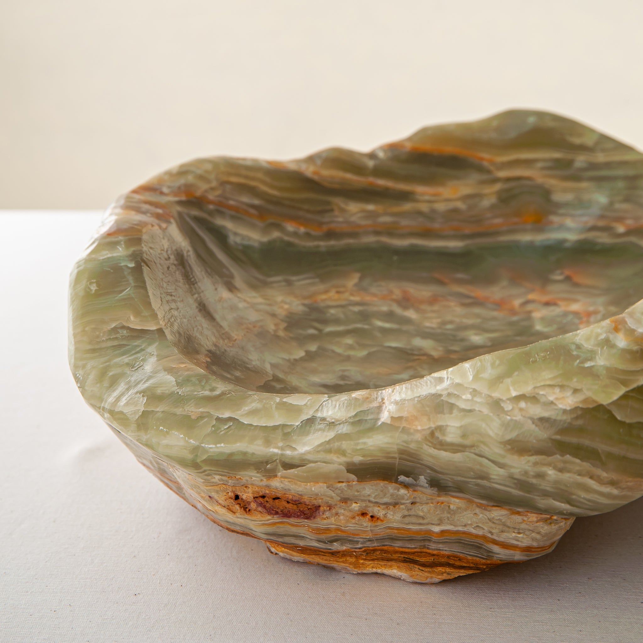 handcrafted onyx bowl with warm amber tones and natural veining for luxury table decor
