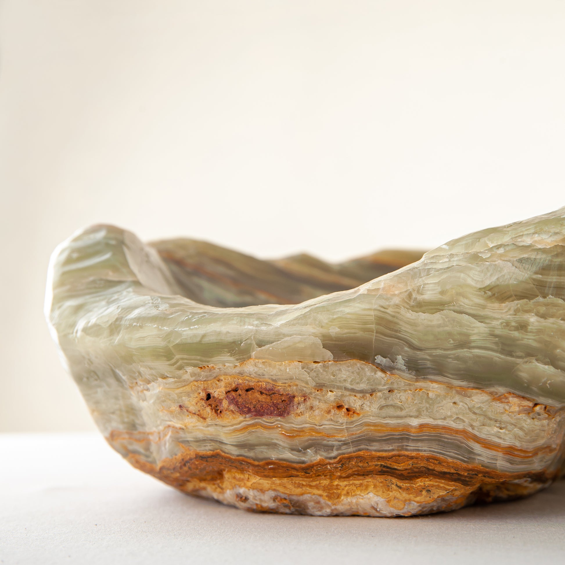 handcrafted onyx bowl with warm amber tones and natural veining for luxury table decor
