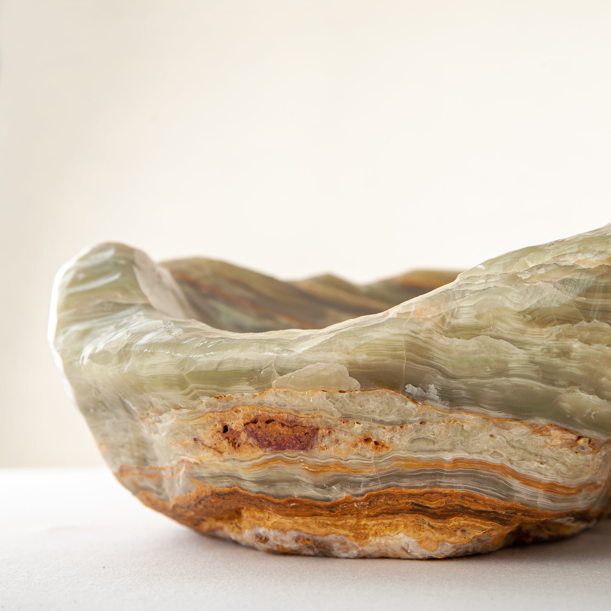 handcrafted onyx bowl with warm amber tones and natural veining for luxury table decor
