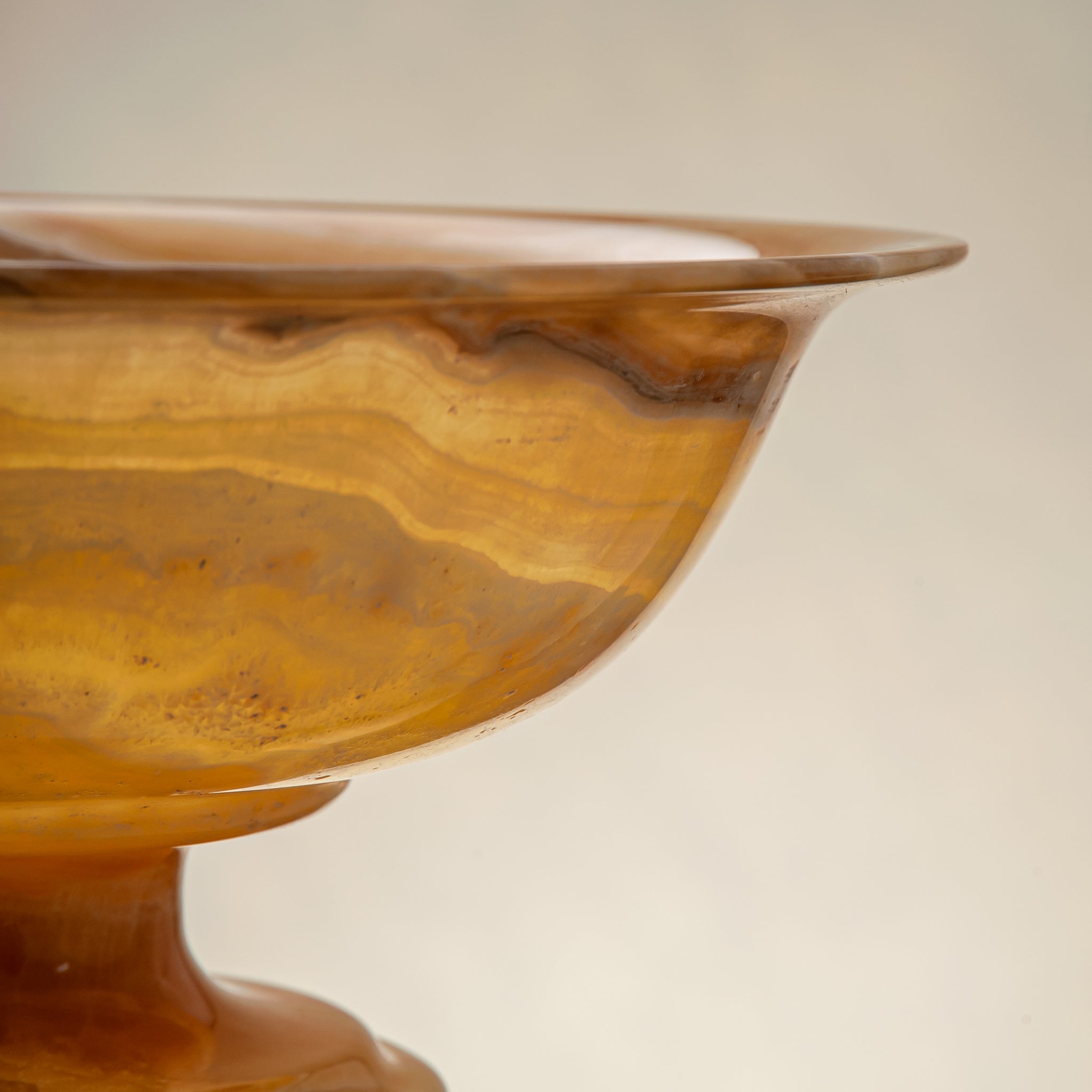 handcrafted onyx bowl with golden tones and caramel veining for luxury table decor
