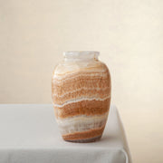 handcrafted onyx vase with terracotta and ivory banding for warm interior decor
