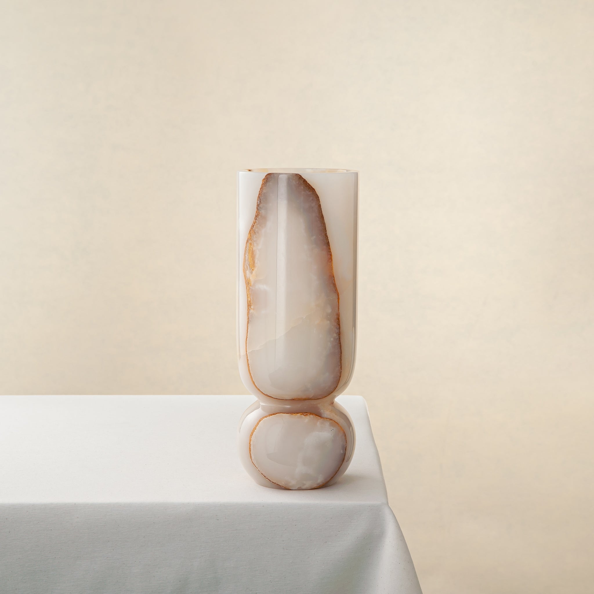 Handcrafted onyx vase with ivory, honey and amber veining by Uniiqo Studio
