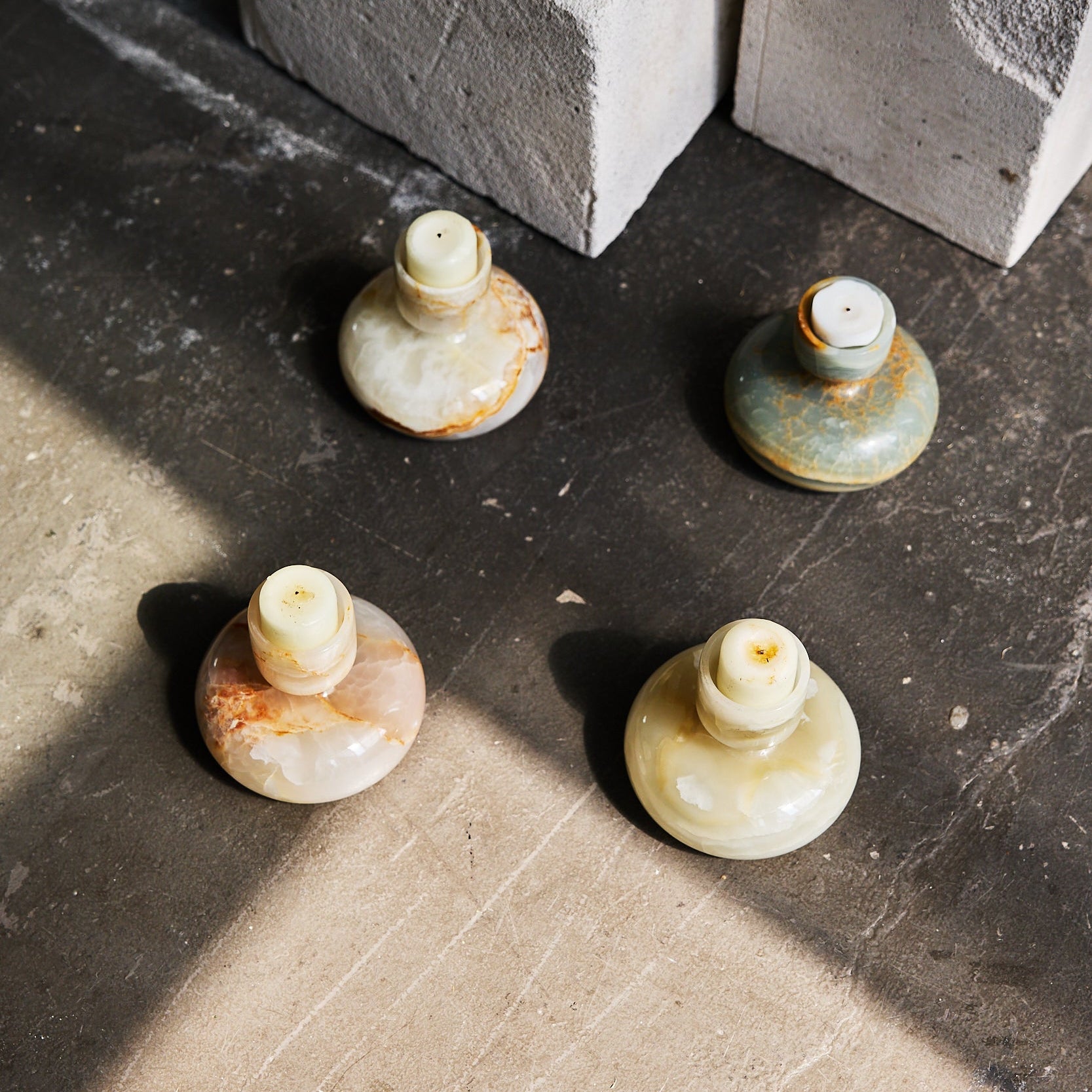 Irus candle holders made out of onyx by Uniiqo Studio