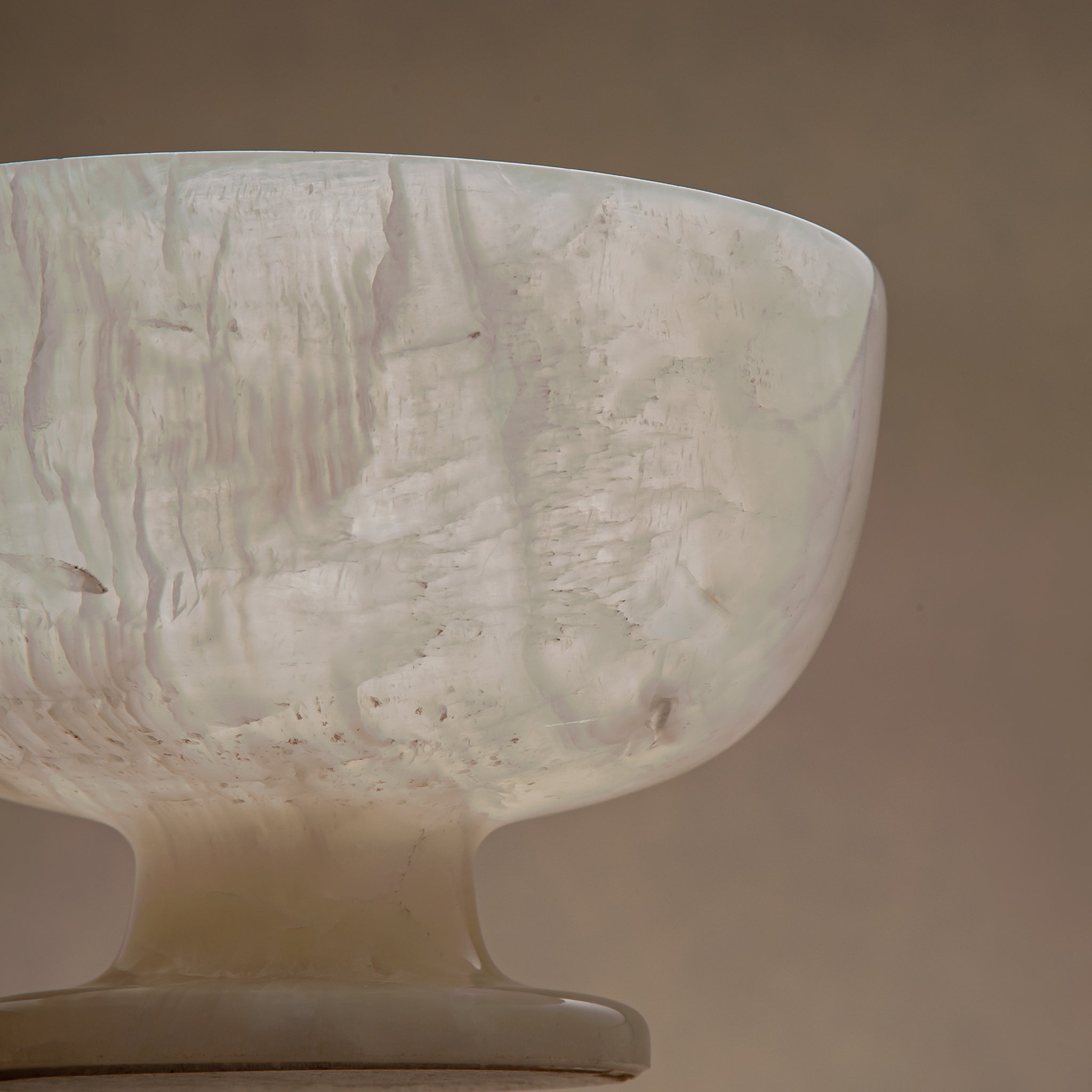handcrafted alabaster pedestal bowl with translucent ivory stone and smooth polished surface
