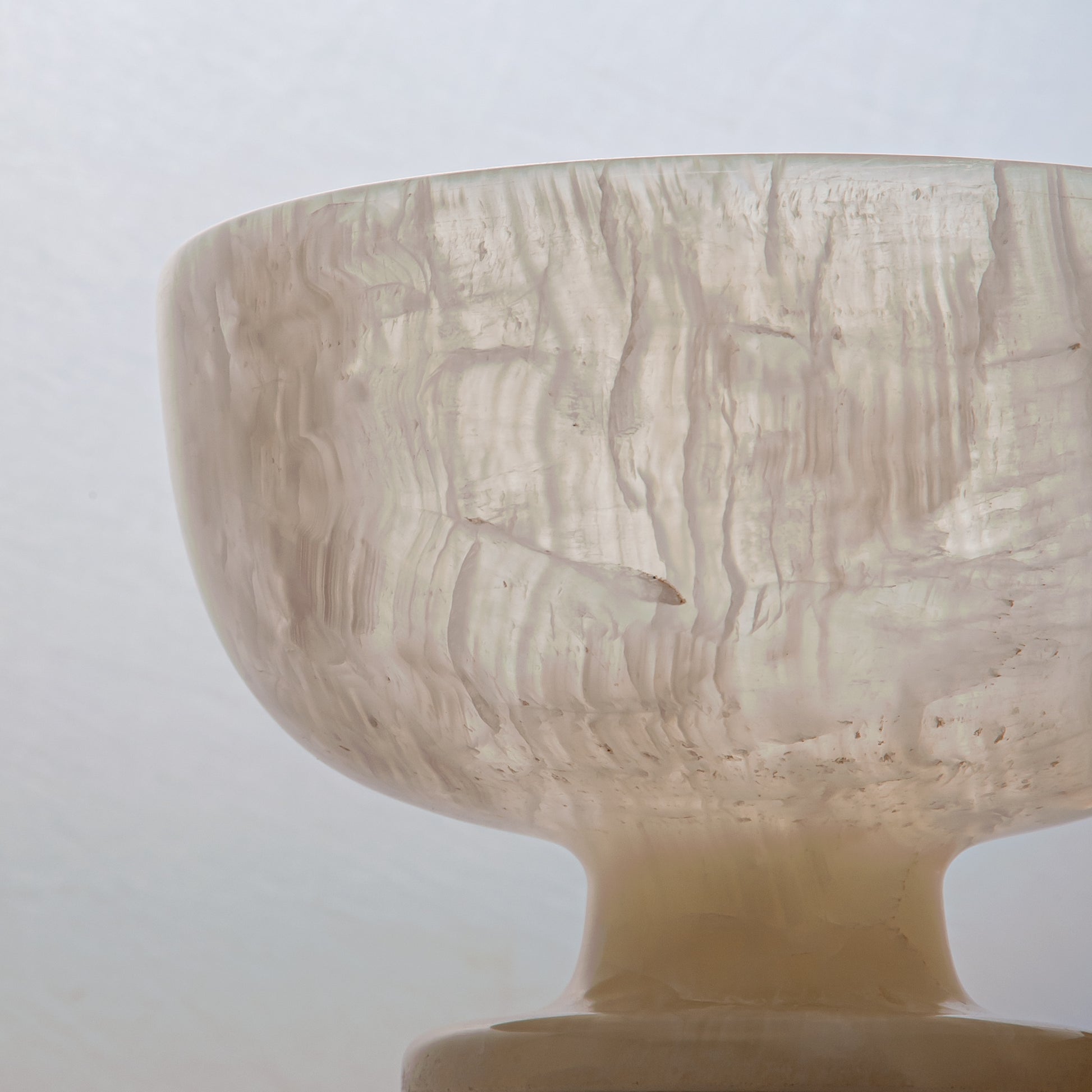 handcrafted alabaster pedestal bowl with translucent ivory stone and smooth polished surface
