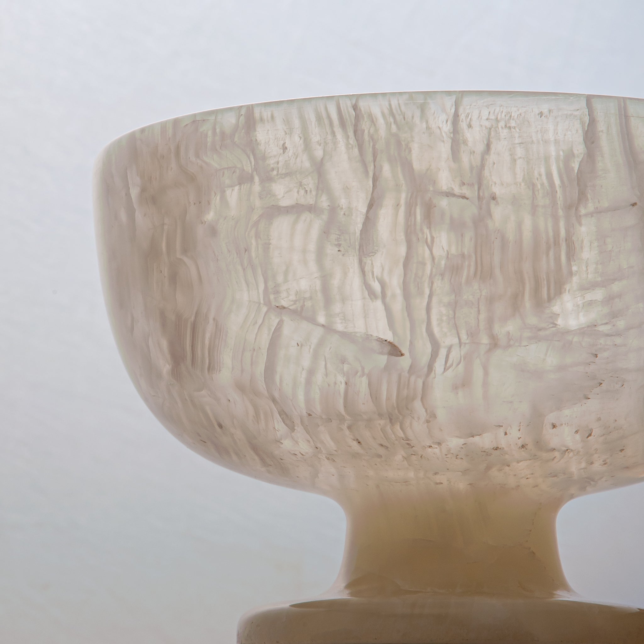 handcrafted alabaster pedestal bowl with translucent ivory stone and smooth polished surface
