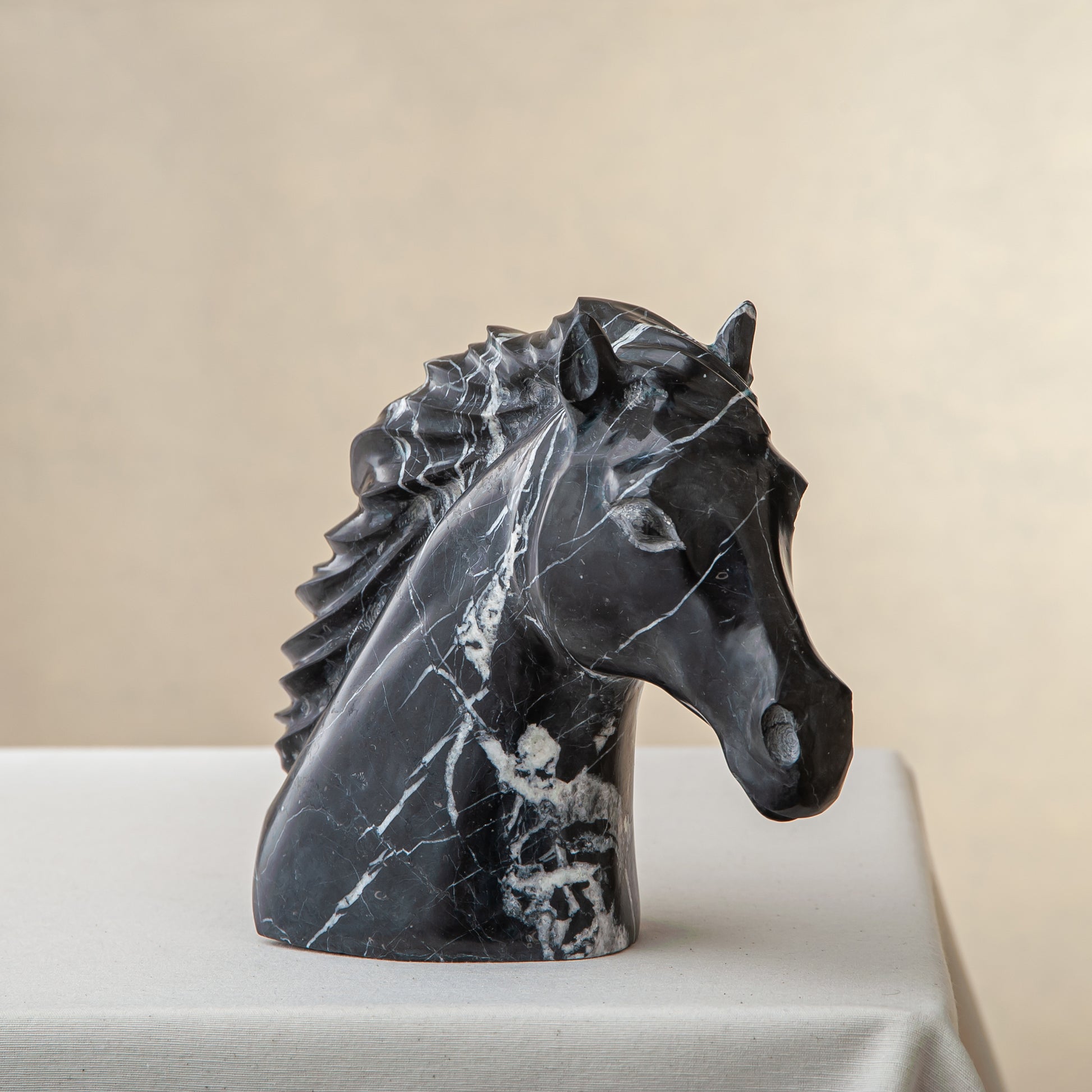 Unique handcrafted black marble horse sculpture with striking white veining

