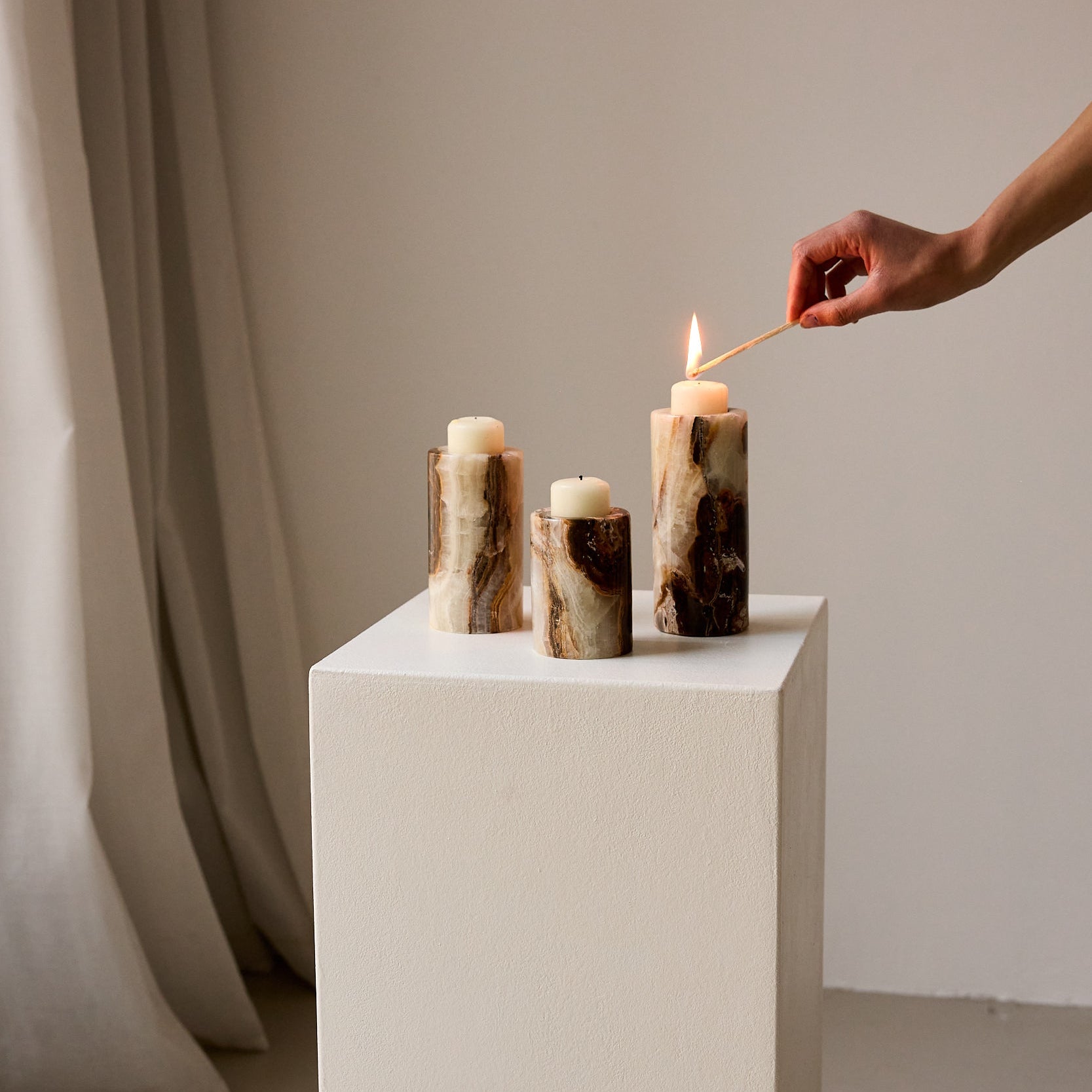 Candle holder set of three of unique onyx in brown with white veining