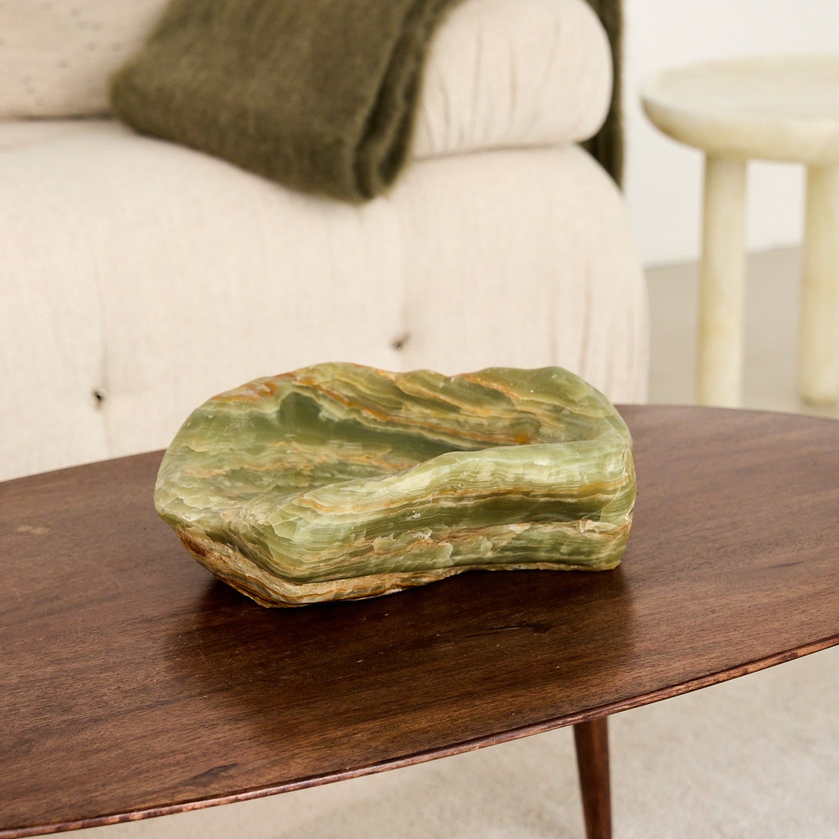one of a kind green onyx bowl centerpiece of a modern coffee table