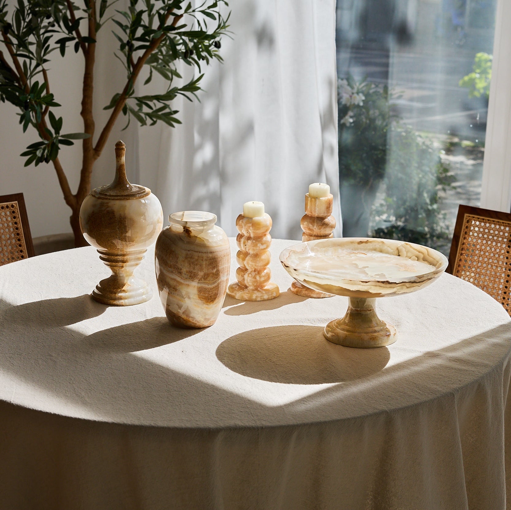 Light brown onyx vase with unique stone and color for home decor. Table set.