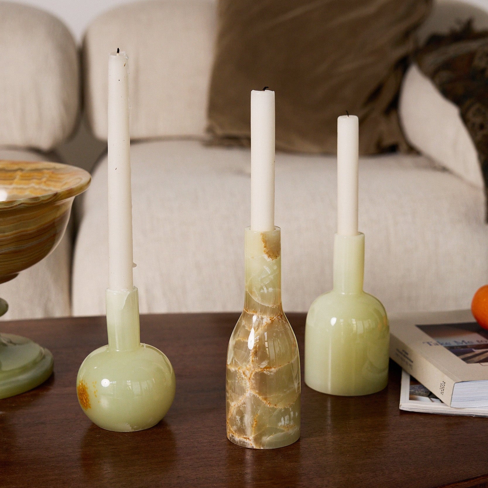 Unique handcrafted set of three light green onyx candle holders with translucent polished finish
