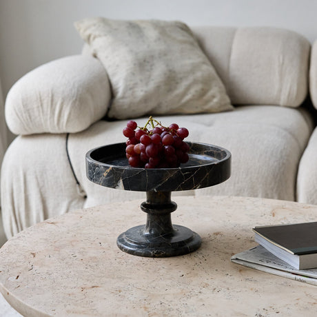 Handcrafted marble bowl with dark tones and warm veining also usable as elegant cake stand
