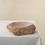 Unique handcrafted marble bowl with raw exterior and natural earthy veining
