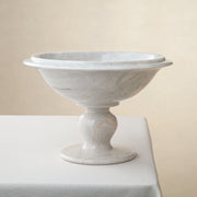 handcrafted marble bowl with white surface and subtle grey veining on pedestal for luxury decor
