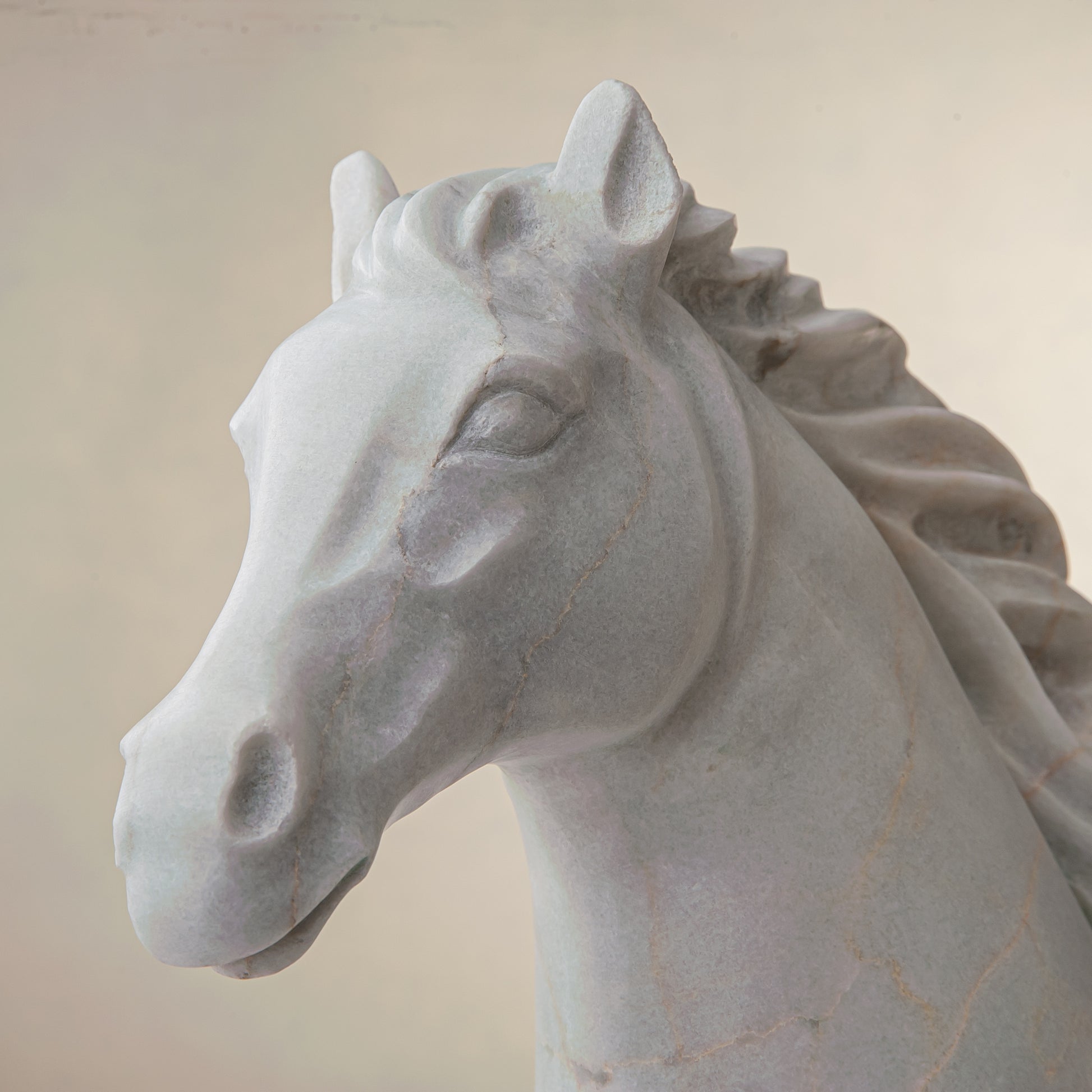 handcrafted marble horse sculpture with white stone and subtle warm veining for luxury decor
