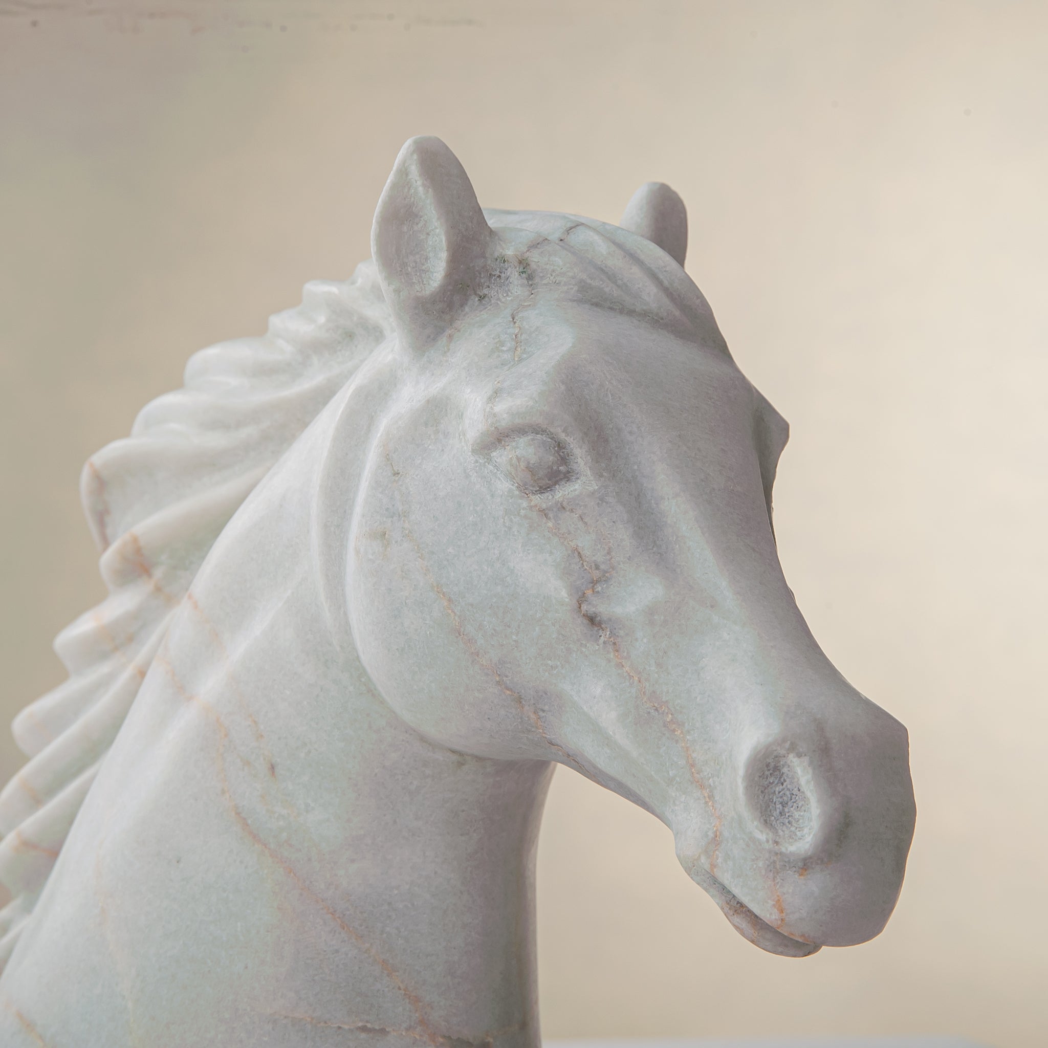 handcrafted marble horse sculpture with white stone and subtle warm veining for luxury decor
