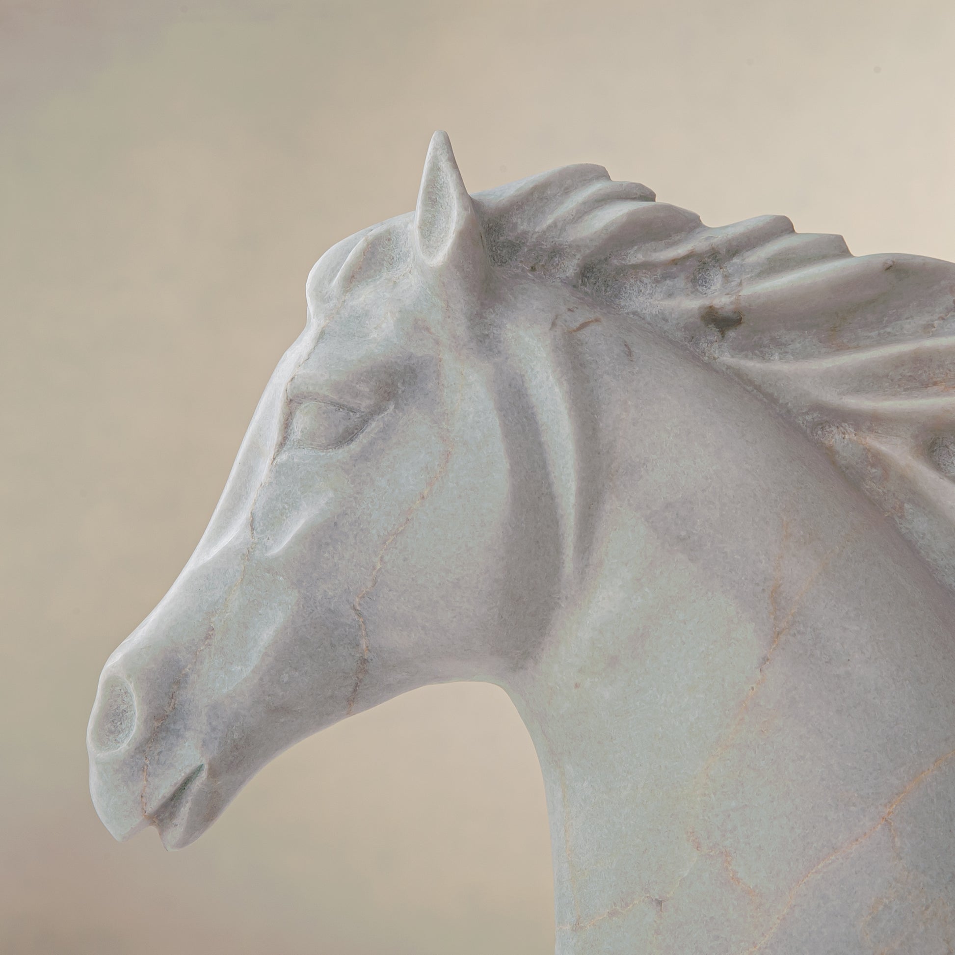 handcrafted marble horse sculpture with white stone and subtle warm veining for luxury decor
