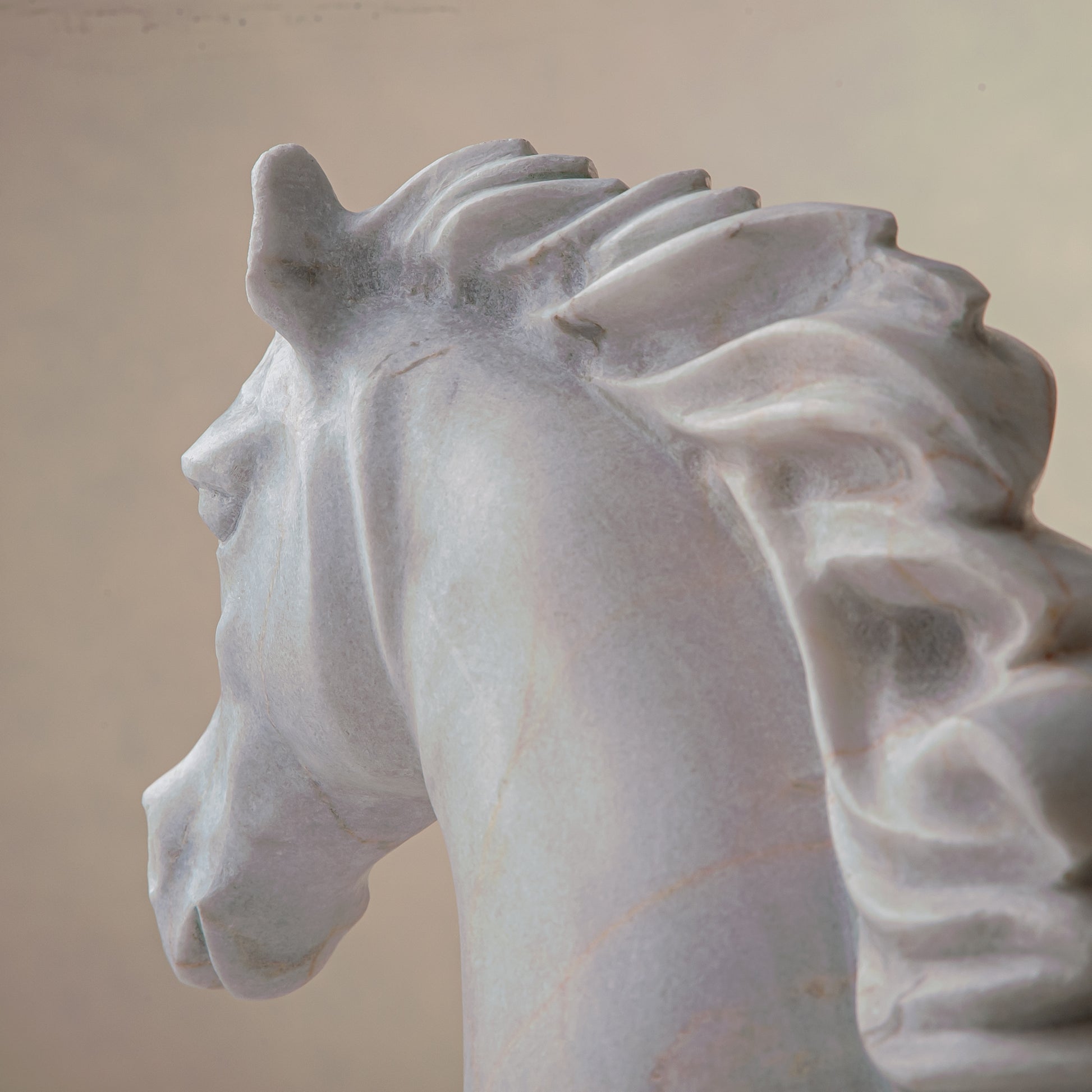 handcrafted marble horse sculpture with white stone and subtle warm veining for luxury decor
