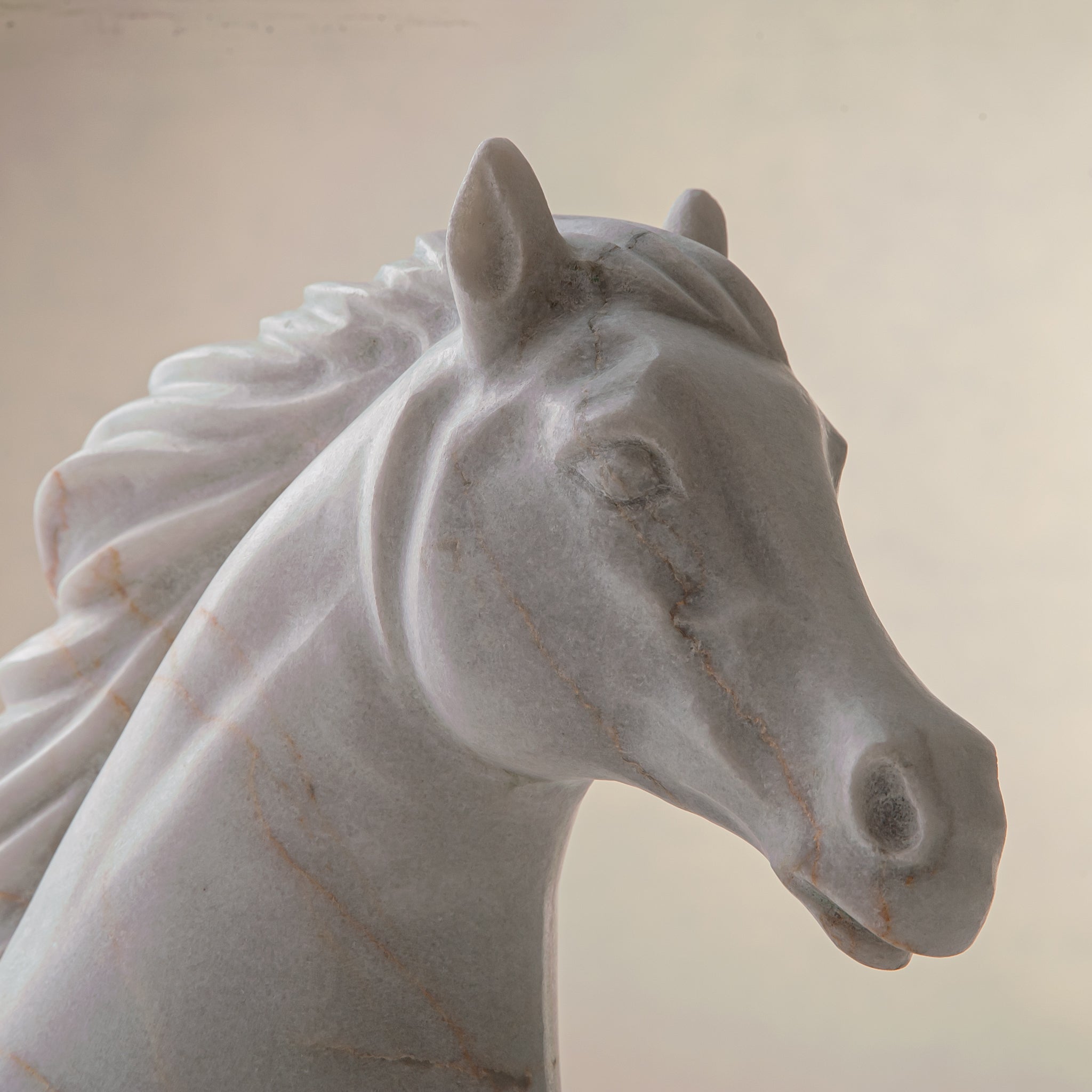 handcrafted marble horse sculpture with white stone and subtle warm veining for luxury decor

