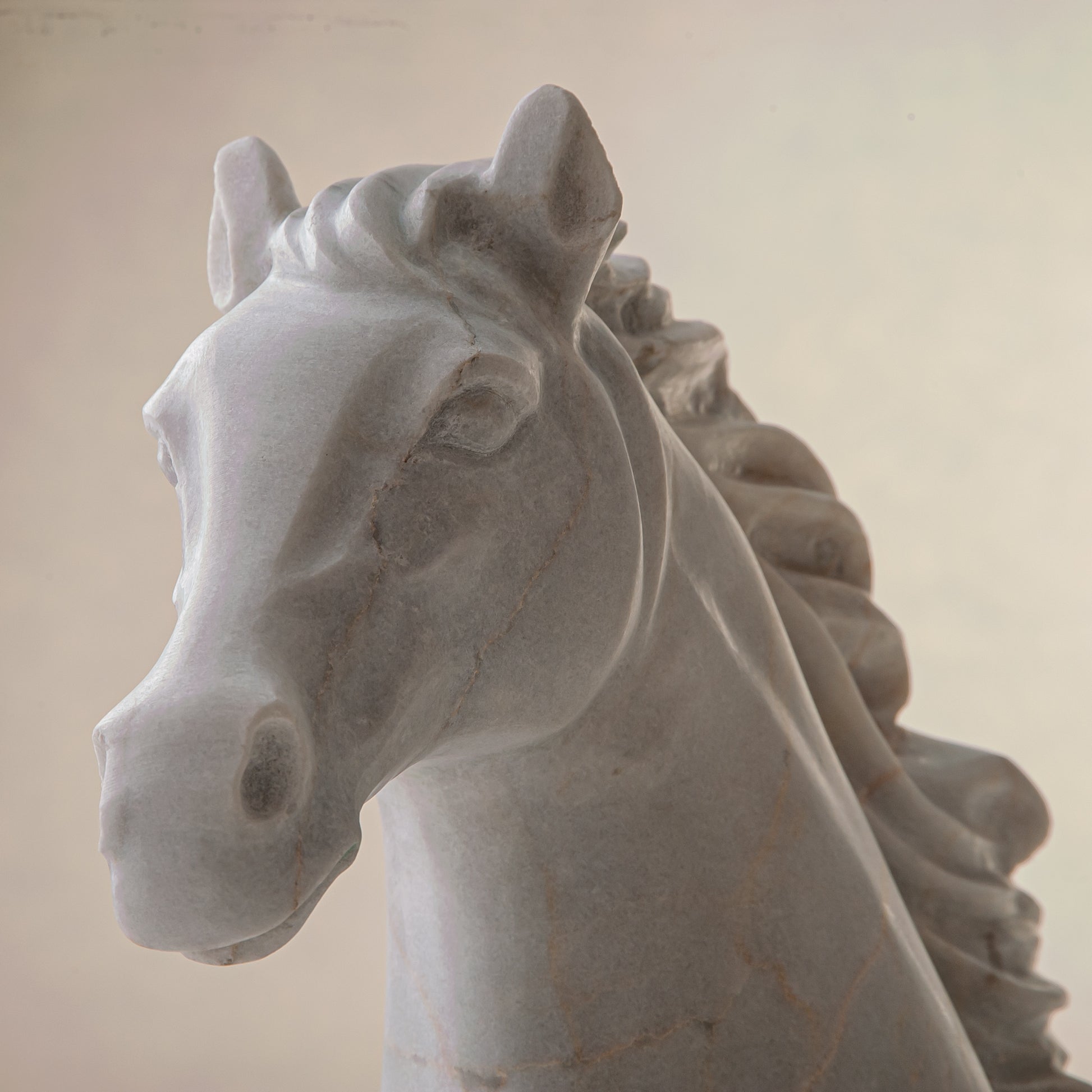 handcrafted marble horse sculpture with white stone and subtle warm veining for luxury decor
