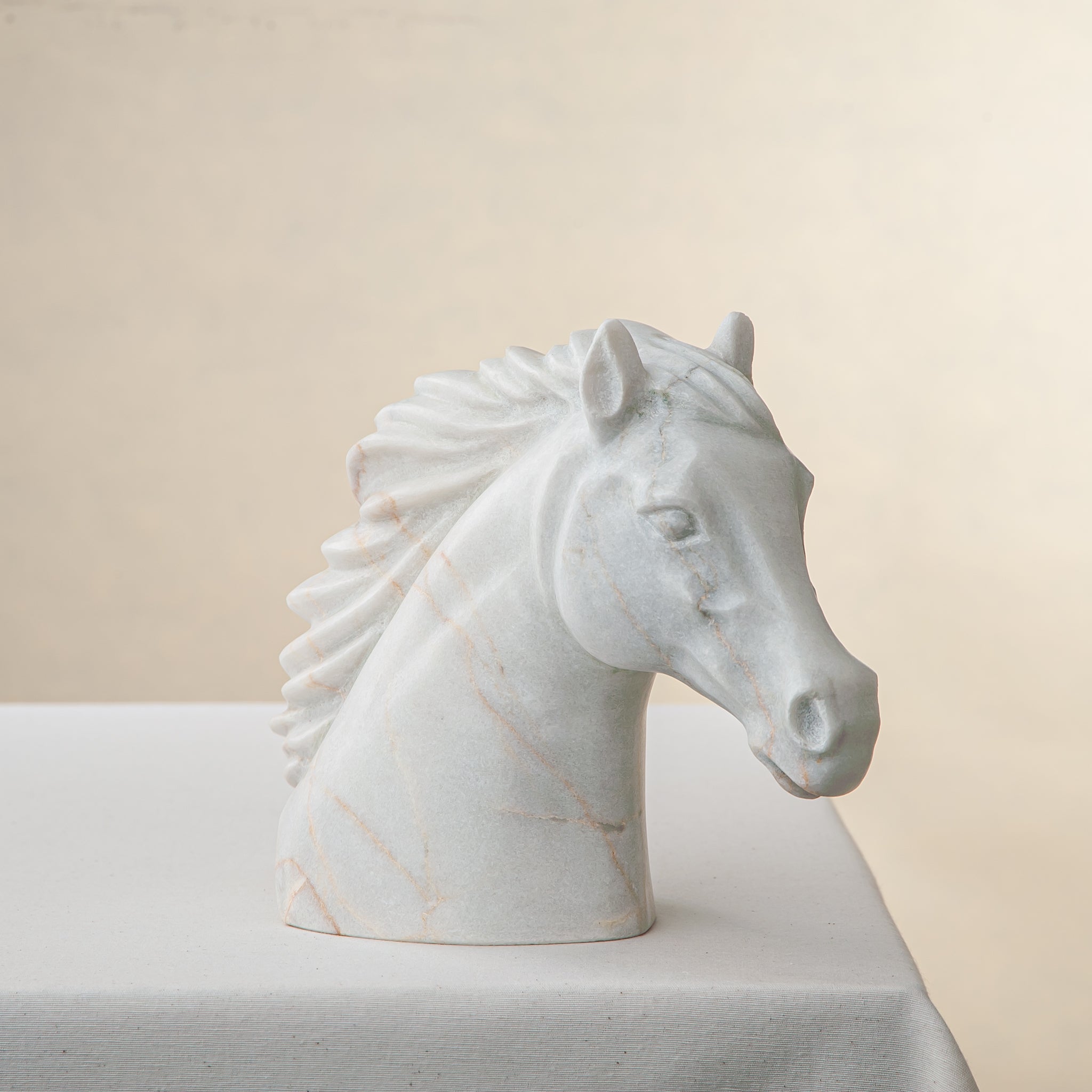 handcrafted marble horse sculpture with white stone and subtle warm veining for luxury decor
