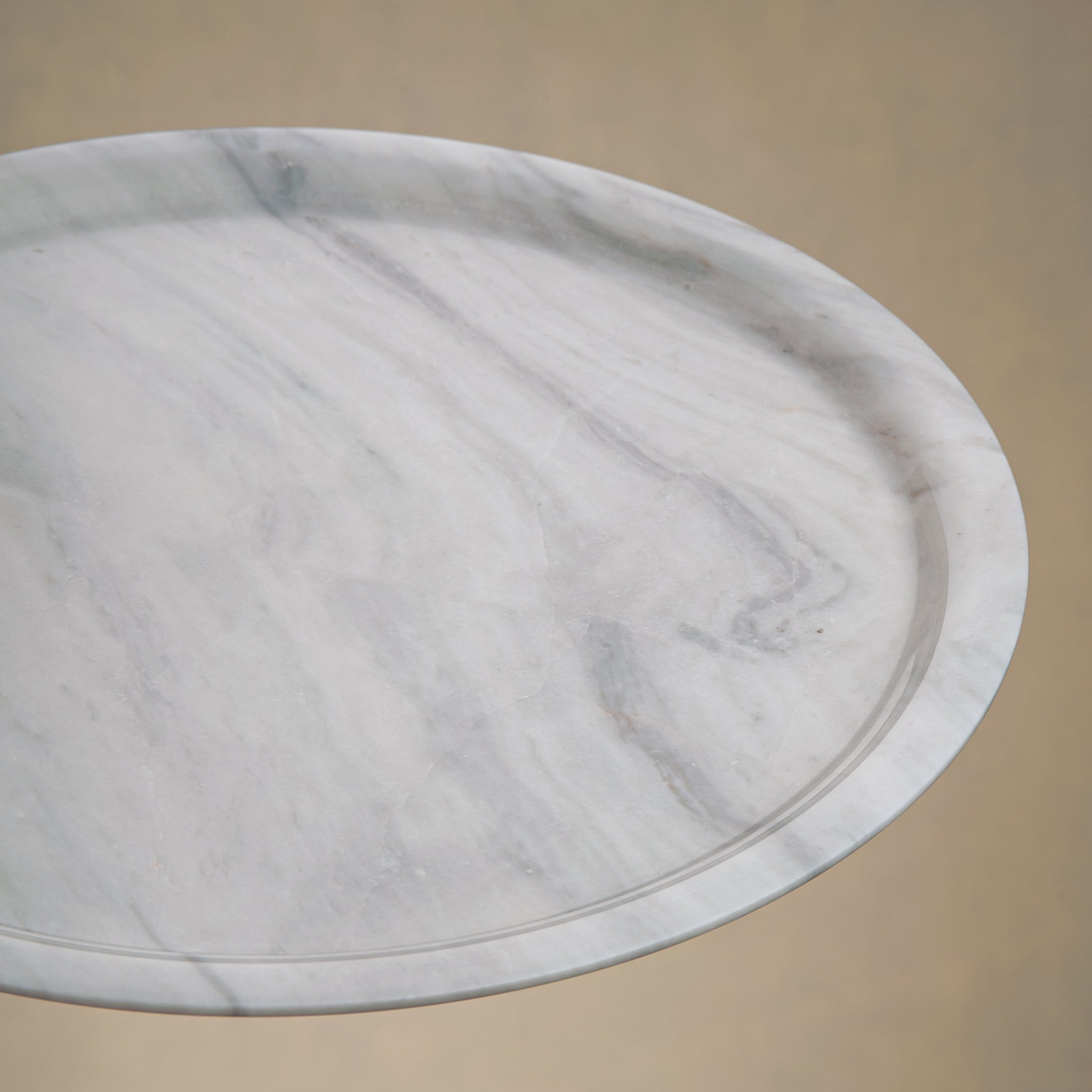 handcrafted marble plate with soft white surface and grey veining for elegant table decor
