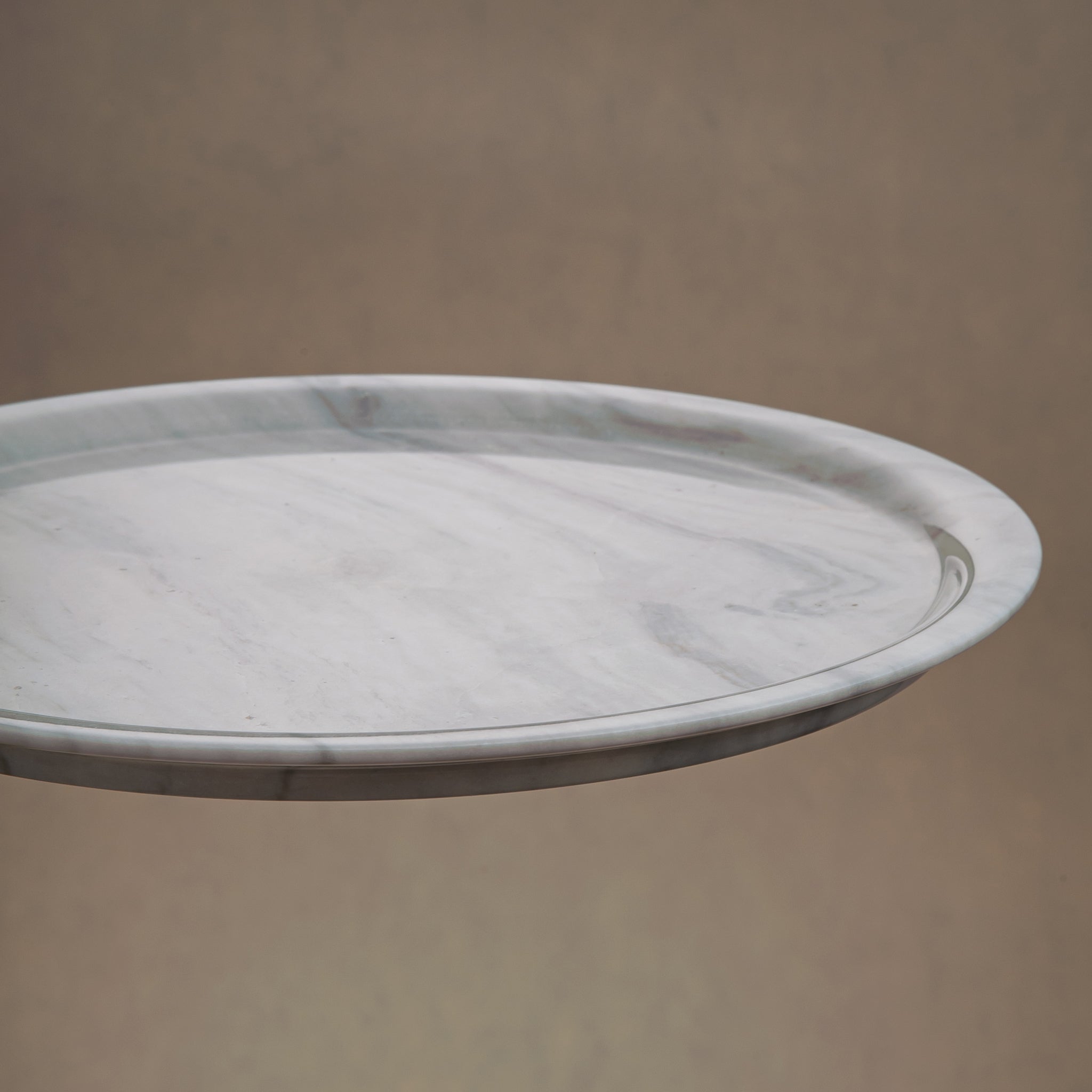 handcrafted marble plate with soft white surface and grey veining for elegant table decor
