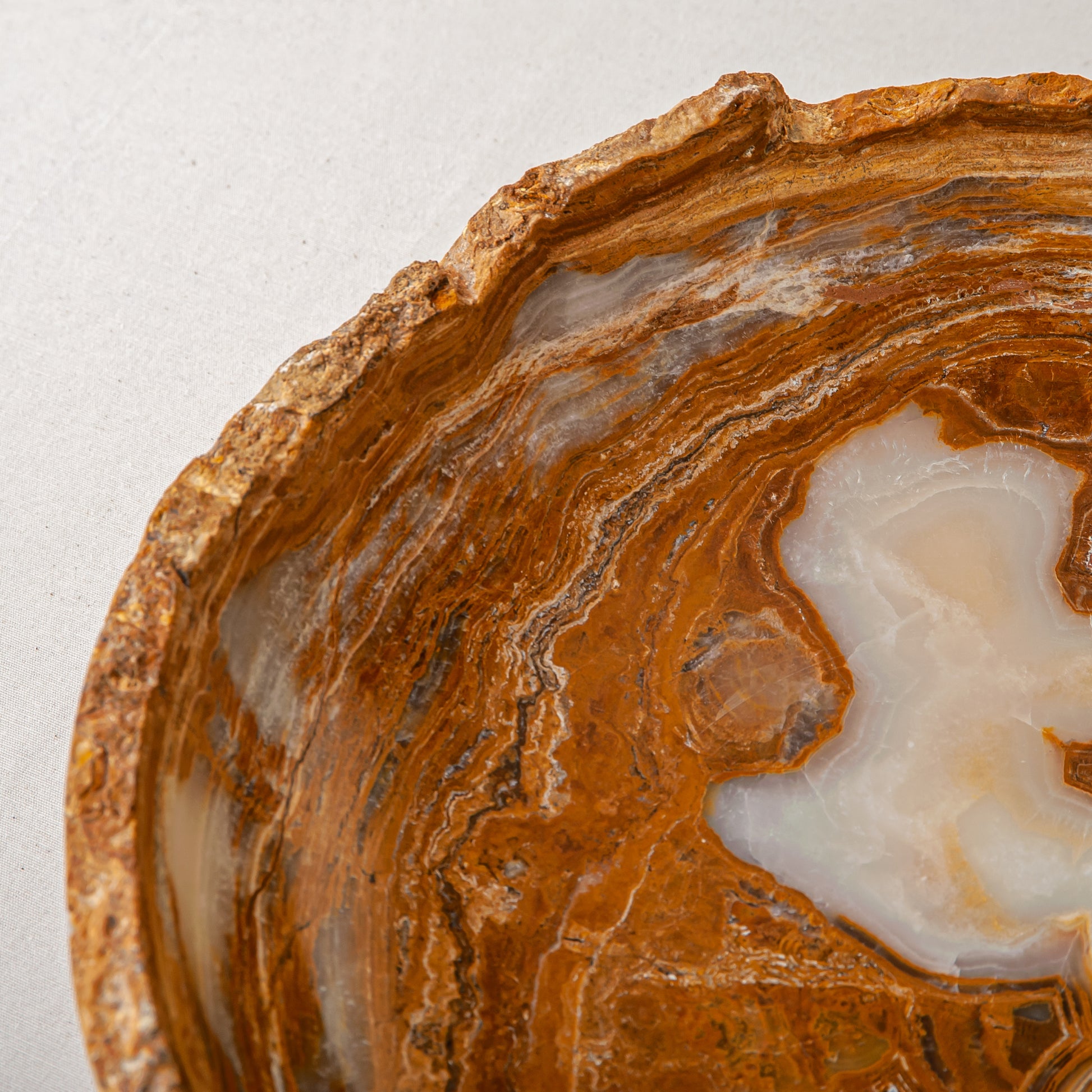 handcrafted onyx bowl with raw edge and amber rust veining for statement decor
