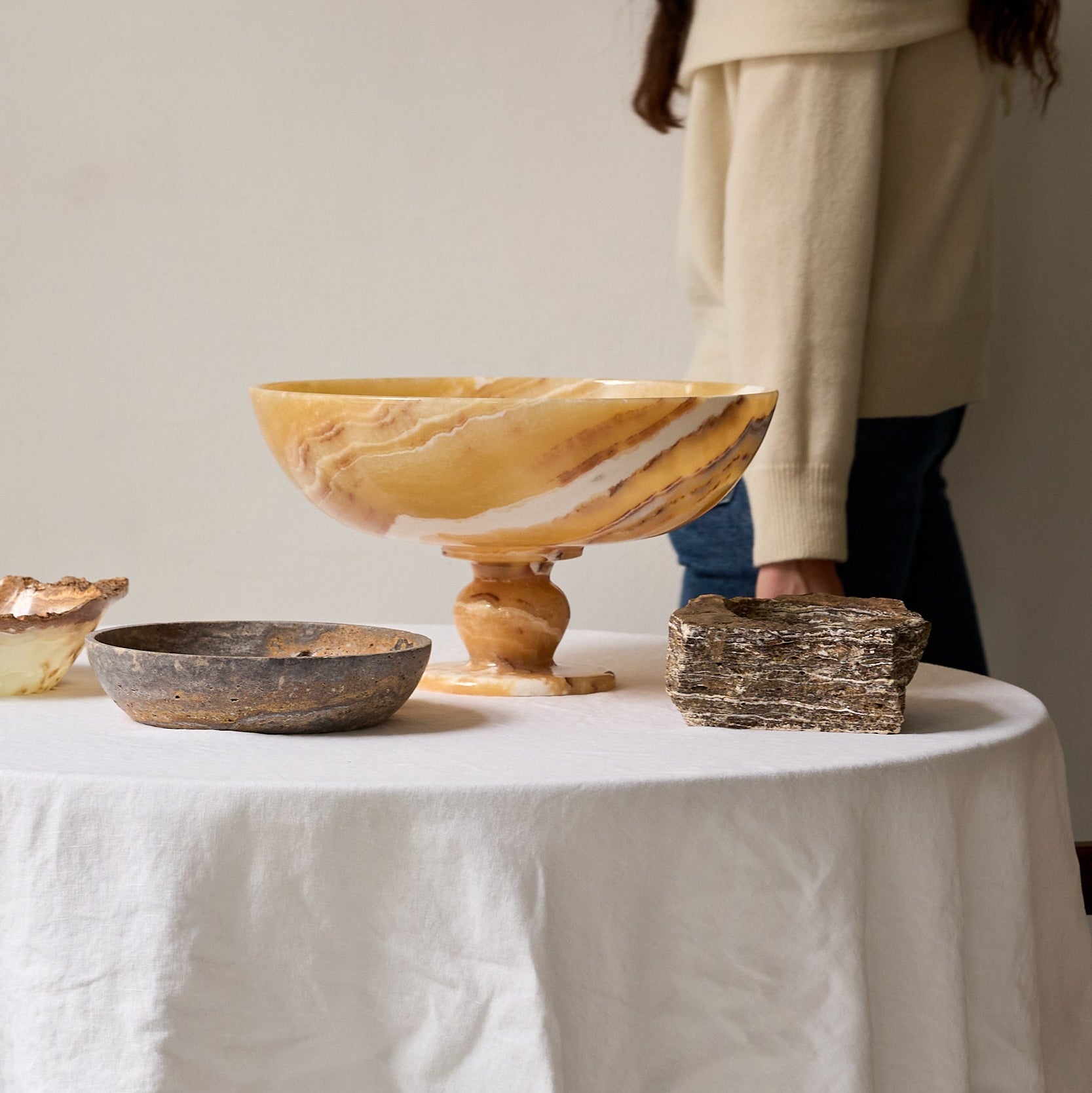 decorative bowls on an elegant dining table by uniiqo studio