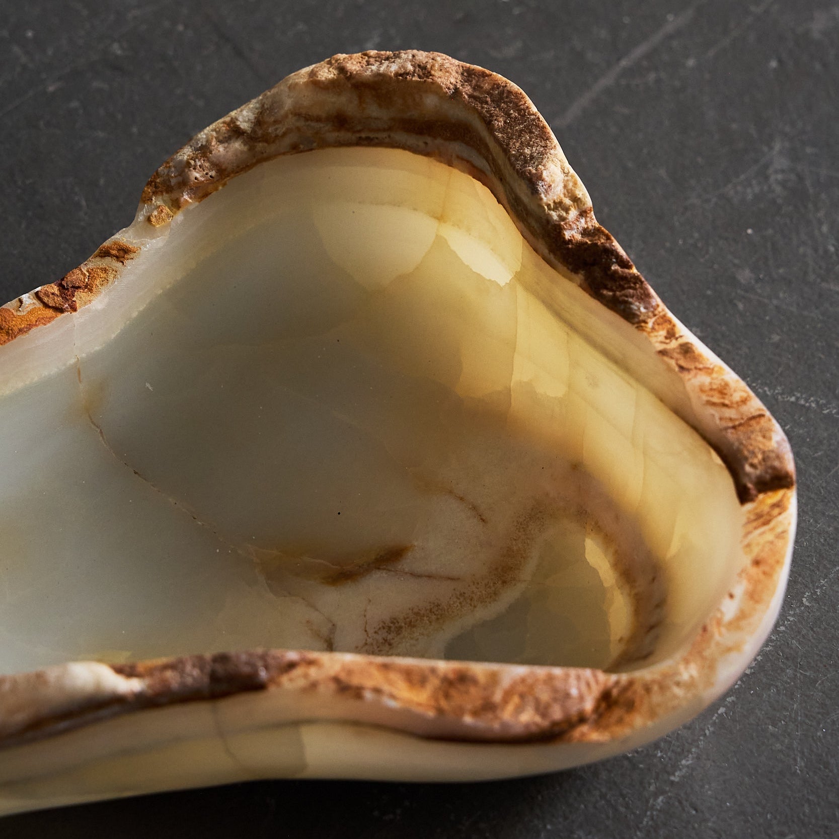 one of a kind translucent onyx bowl in an organic form by Uniiqo Studio