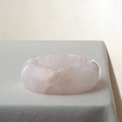 Handcrafted rose onyx ash tray with soft pink tones and smooth sculptural form for elegant table decor
