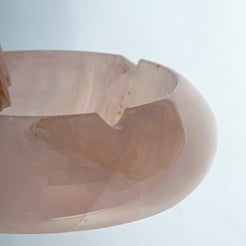 Handcrafted rose onyx ash tray with soft pink tones and smooth sculptural form for elegant table decor
