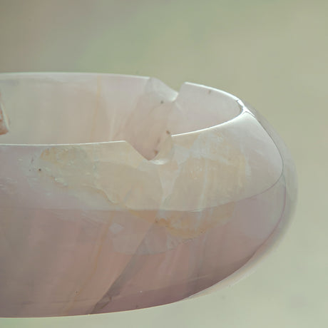 Handcrafted rose onyx ash tray with soft pink tones and smooth sculptural form for elegant table decor
