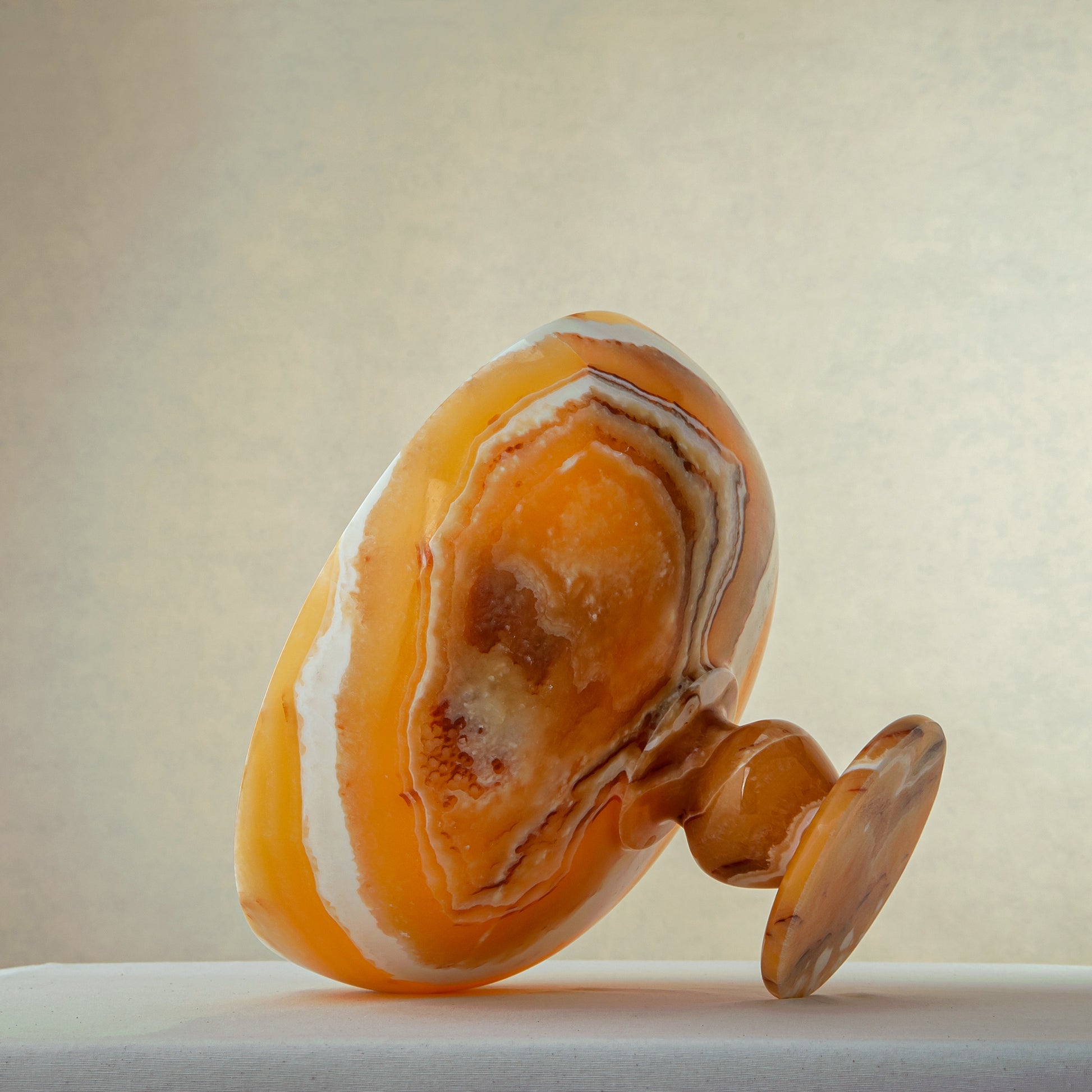 unique onyx bowl warm orange tones layered veining elegant decor
