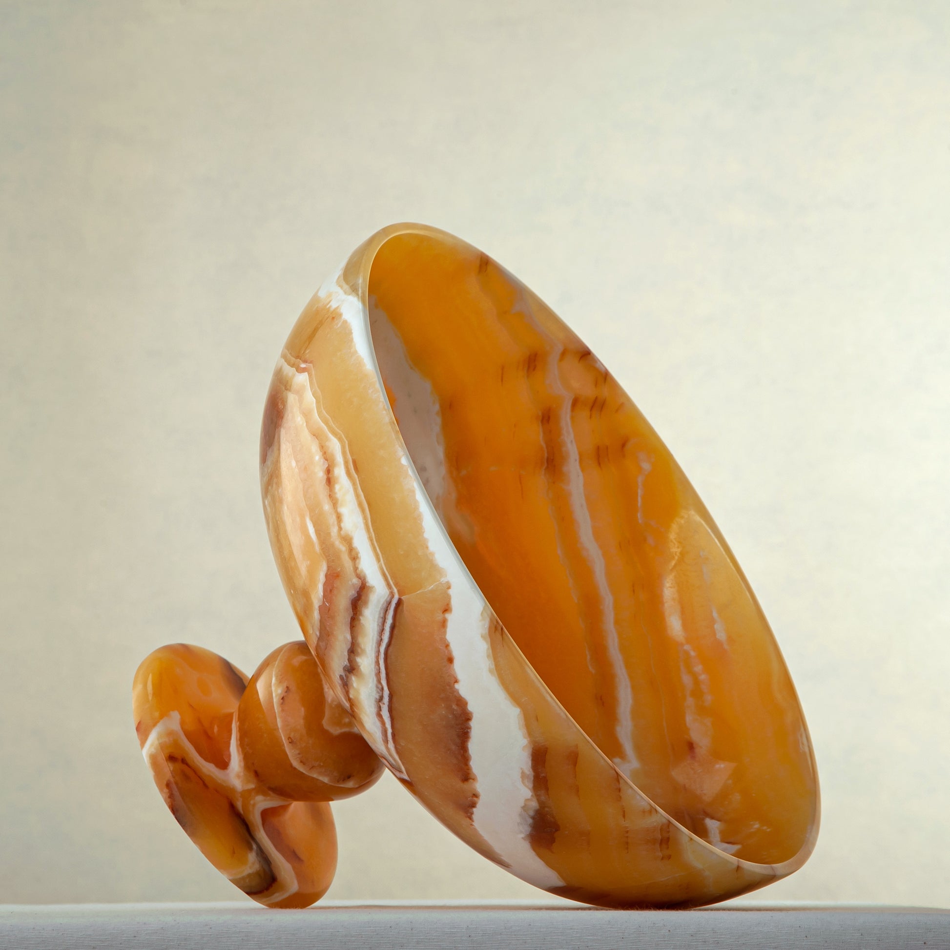 unique onyx bowl warm orange tones layered veining elegant decor
