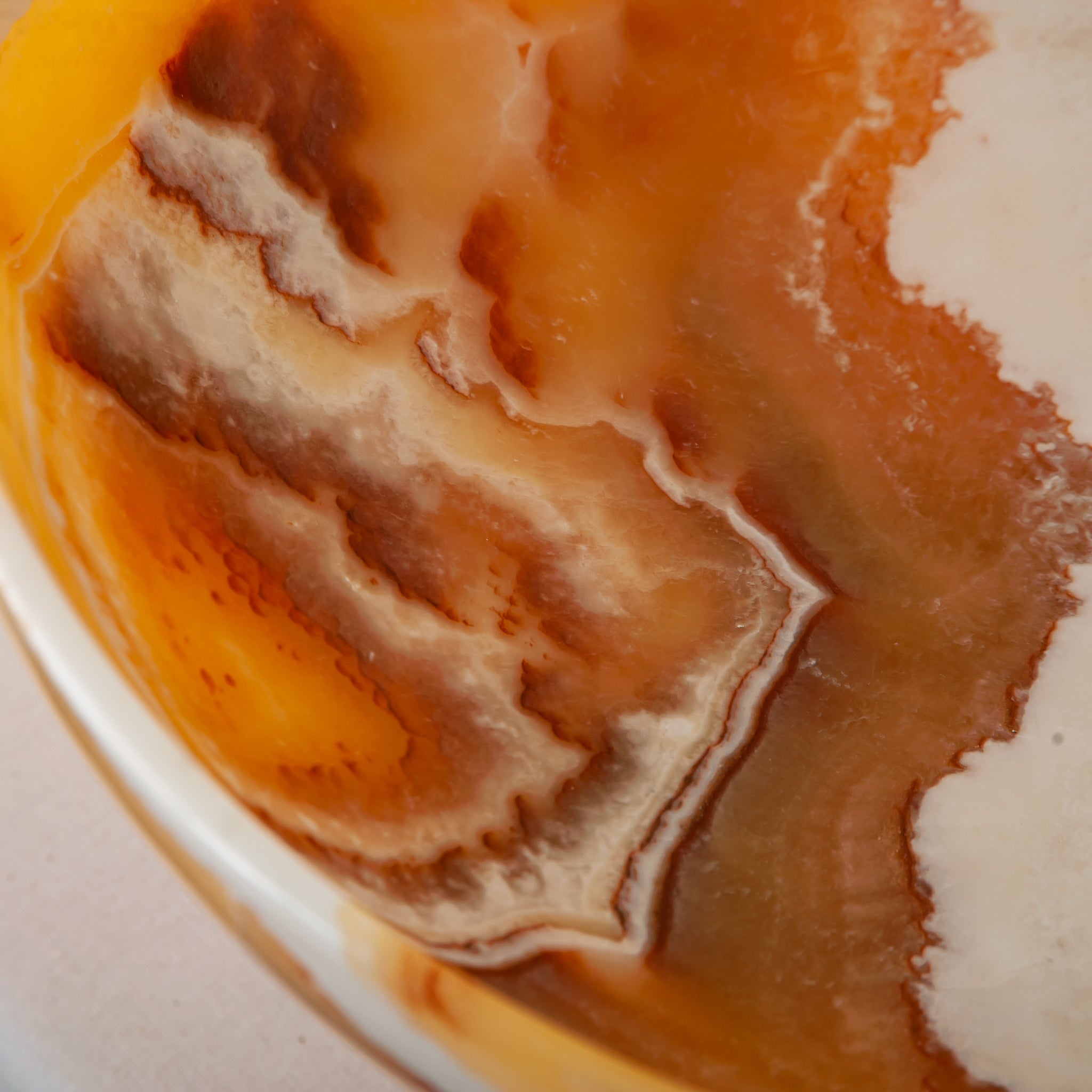 unique onyx bowl warm orange tones layered veining elegant decor
