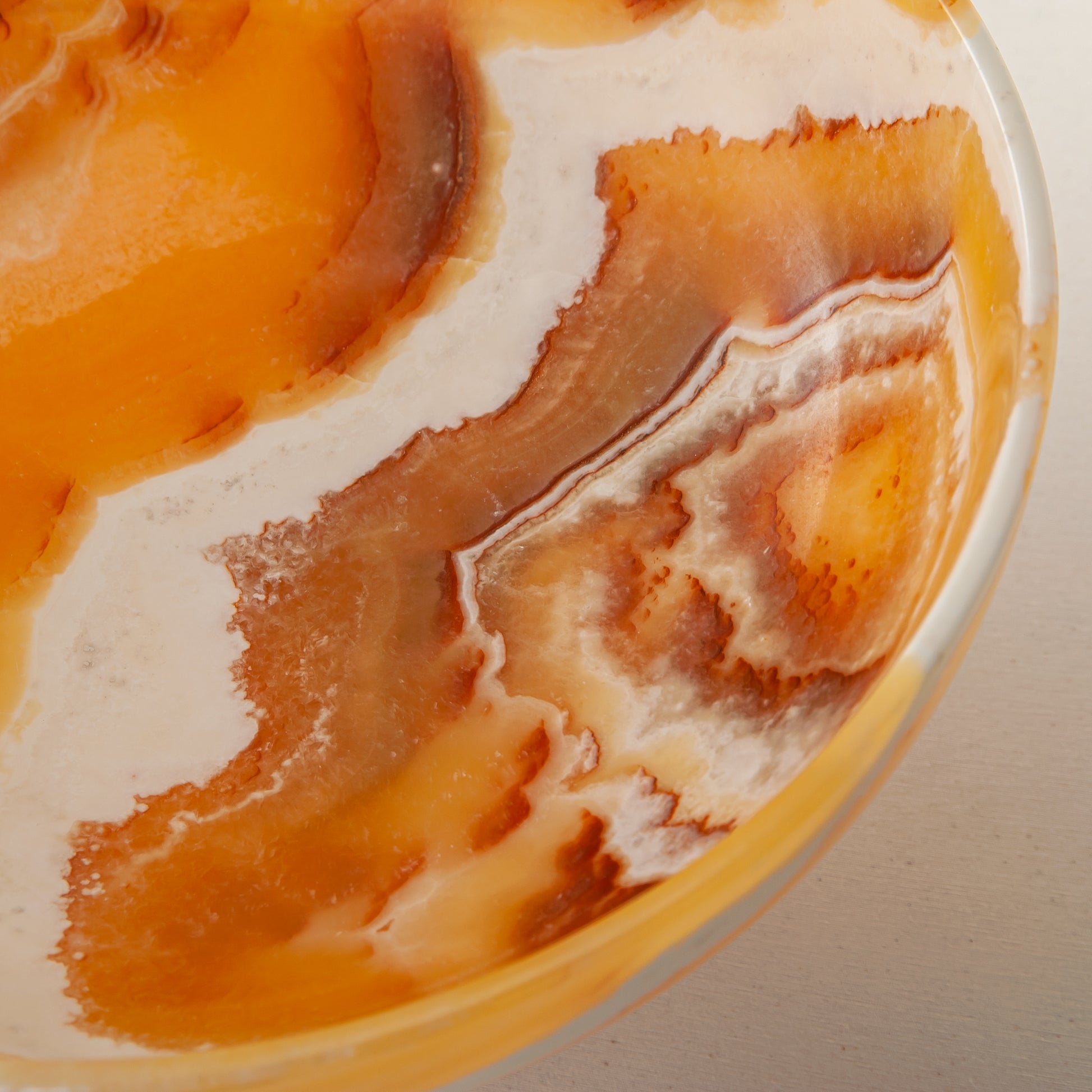 unique onyx bowl warm orange tones layered veining elegant decor
