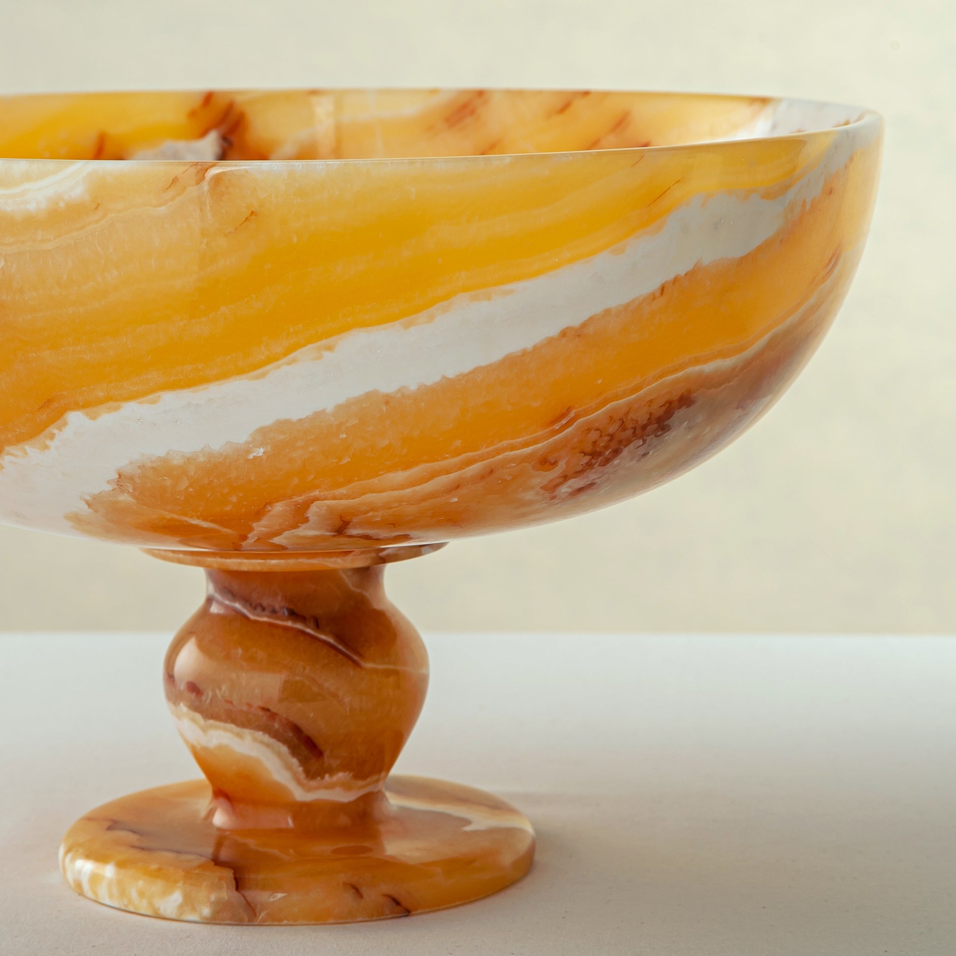 unique onyx bowl warm orange tones layered veining elegant decor
