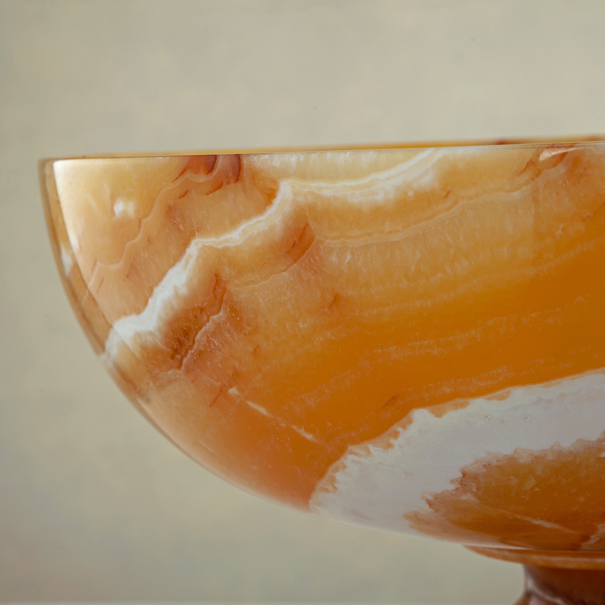 unique onyx bowl warm orange tones layered veining elegant decor
