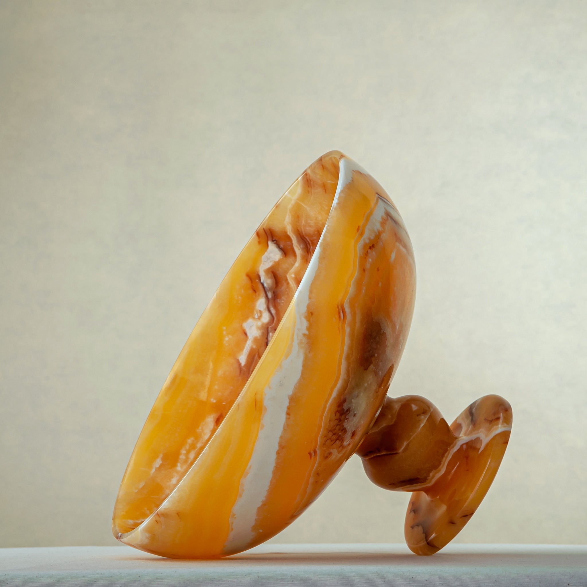 unique onyx bowl warm orange tones layered veining elegant decor
