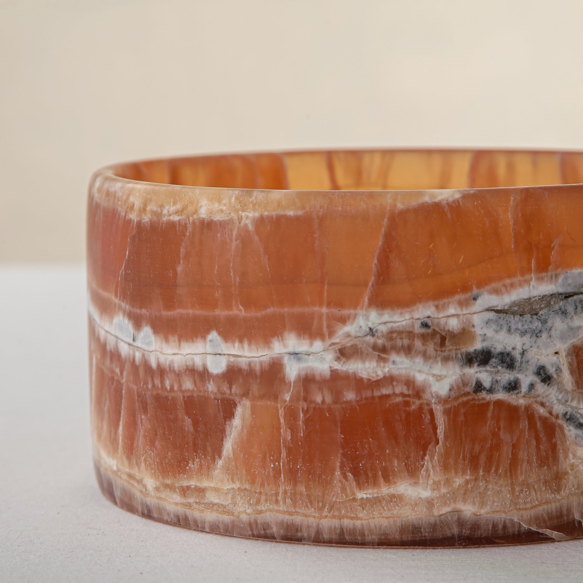 handcrafted onyx bowl with warm amber tones and natural veining for luxury table decor
