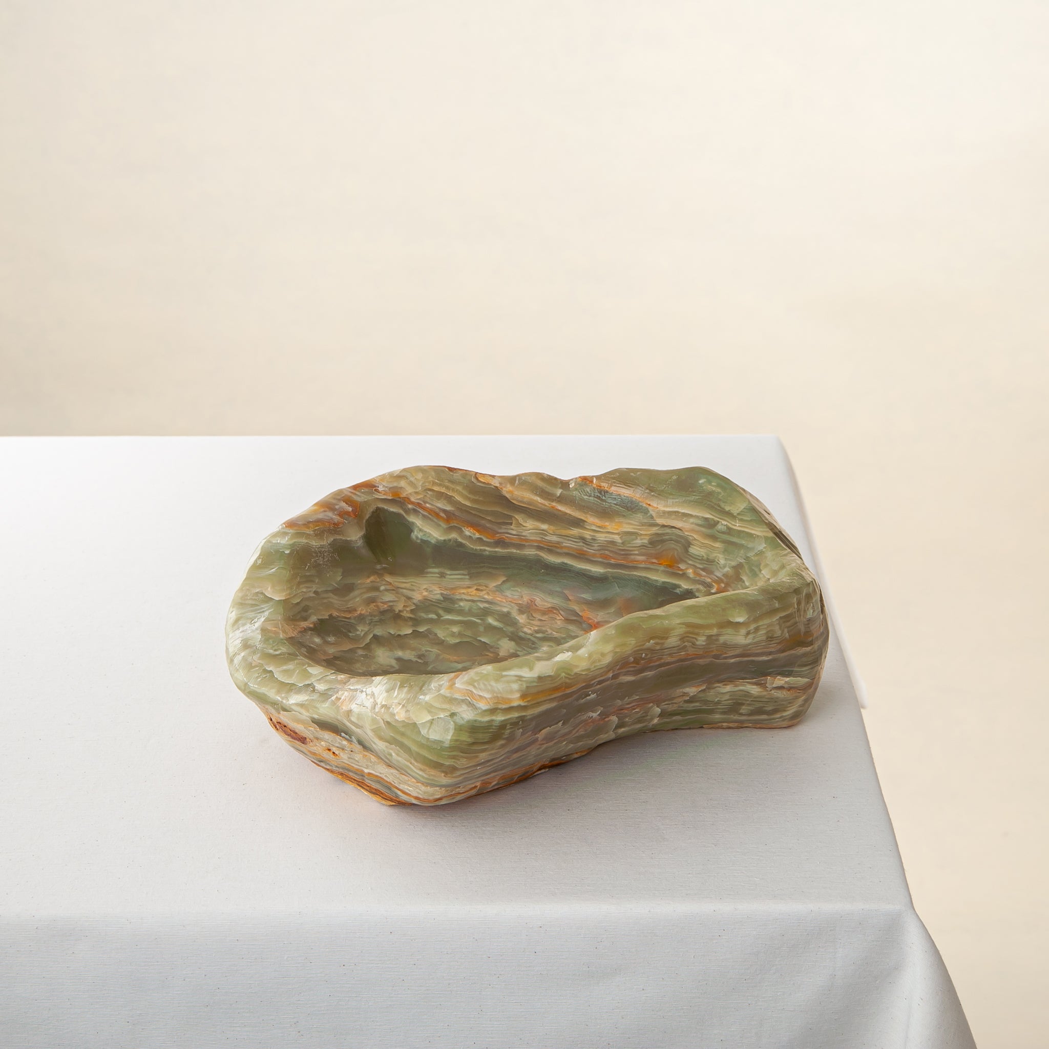handcrafted onyx bowl with warm amber tones and natural veining for luxury table decor
