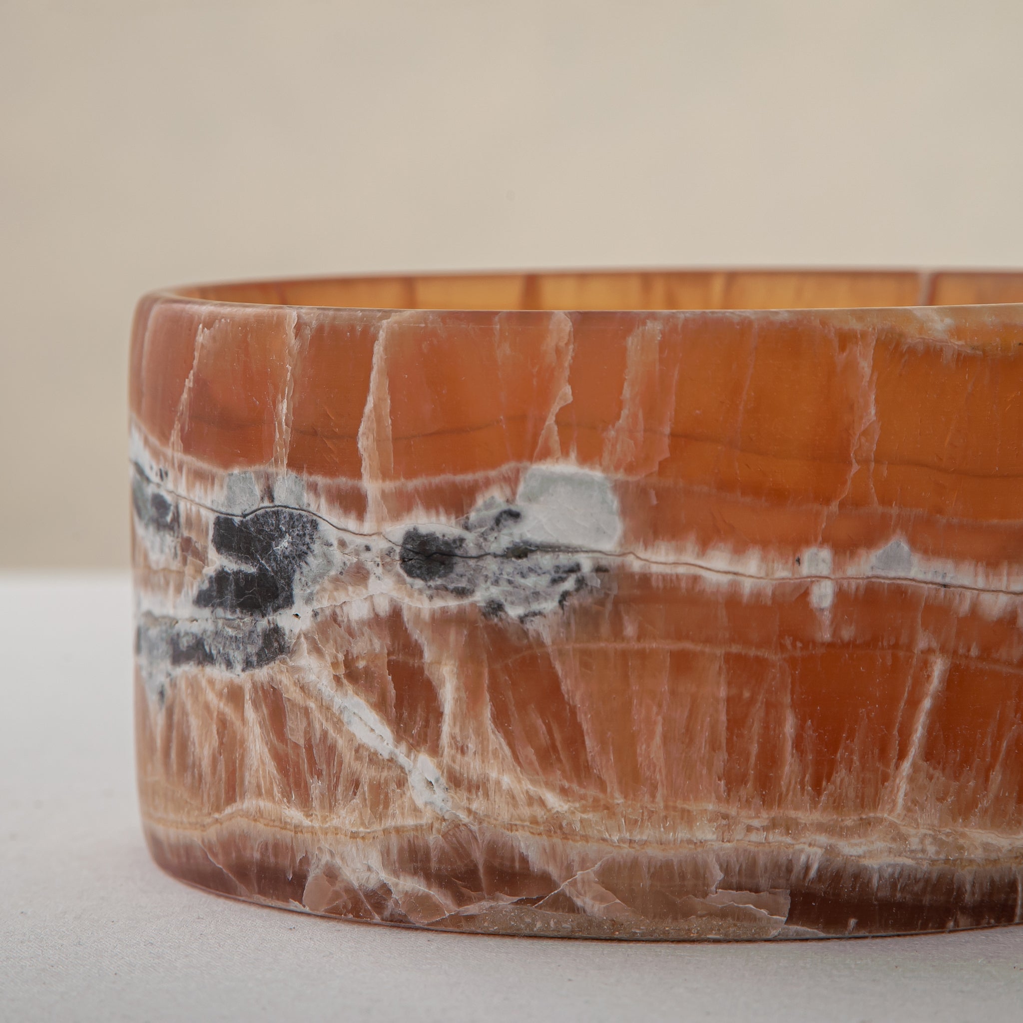 handcrafted onyx bowl with warm amber tones and natural veining for luxury table decor
