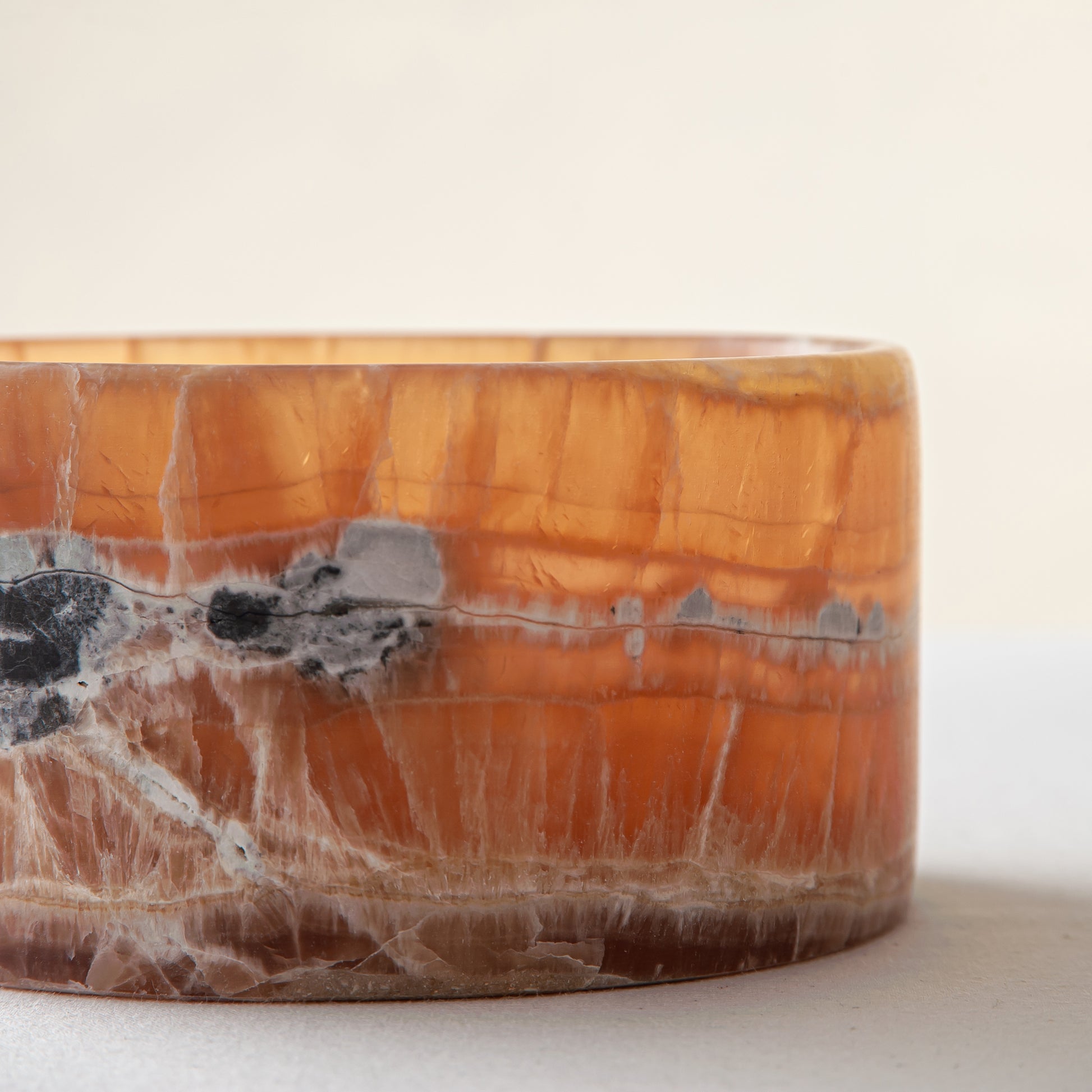 handcrafted onyx bowl with warm amber tones and natural veining for luxury table decor
